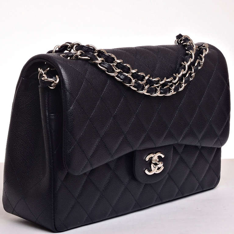 Chanel midnight blue quilted caviar leather Jumbo classic 2.55 double flap bag with silvertone hardware, front flap with CC turnlock closure, half moon back pocket and adjustable interwoven silvertone chain link and midnight blue leather