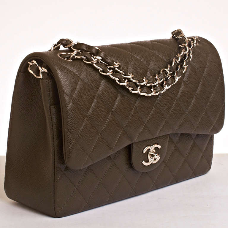 Chanel dark brown quilted caviar leather Jumbo classic 2.55 double flap bag with silvertone hardware, front flap with CC turnlock closure, half moon back pocket and adjustable interwoven silvertone chain link and dark brown leather
