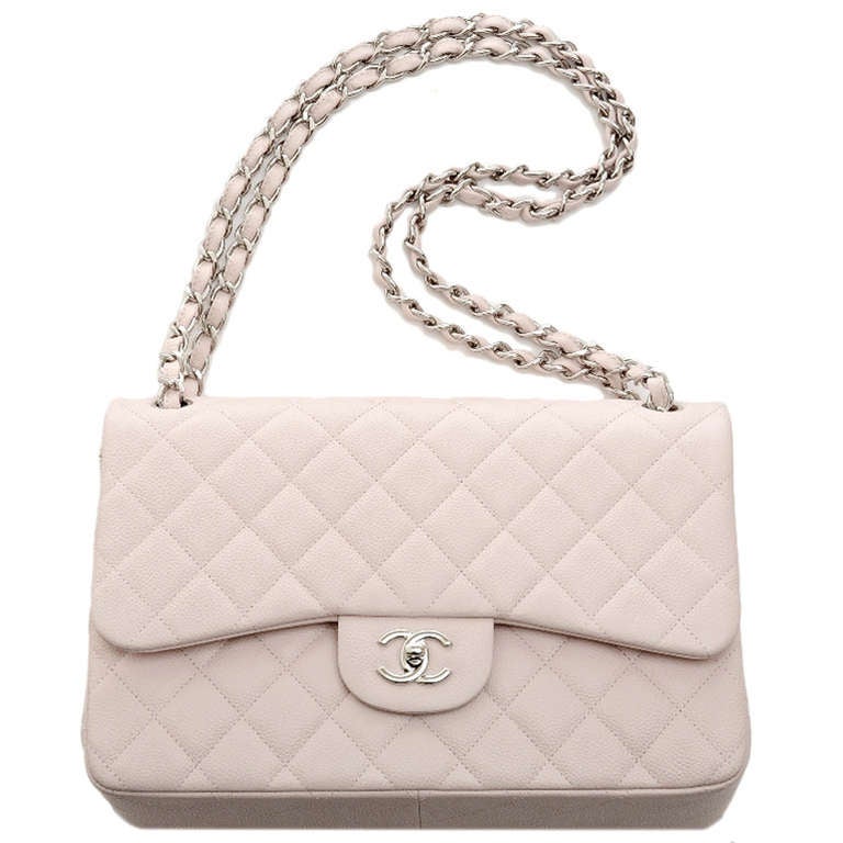 Chanel baby pink quilted caviar leather Jumbo classic 2.55 double flap bag with silvertone hardware, front flap CC turnlock closure, half moon back pocket, adjustable interwoven silvertone chain link and pink leather shoulder/crossbody strap, and