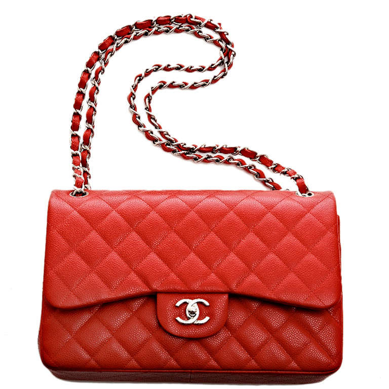 Chanel lipstick red quilted caviar leather Jumbo 2.55 double flap bag with silvertone hardware, front flap with CC turnlock closure, half moon back pocket, and adjustable interwoven silvertone chain link and red leather shoulder/crossbody strap.