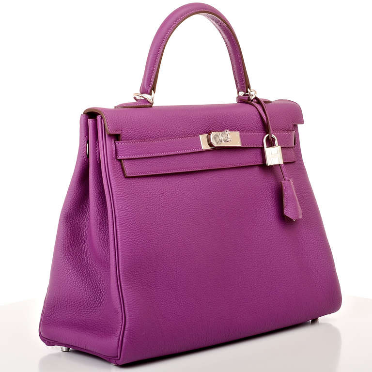 Hermes Anemone togo leather Kelly 35cm with tonal stitching, palladium hardware, front toggle closure, clochette with lock and two keys, single rolled handle and removable shoulder strap. Interior is lined in Anemone chevre and features: one zip