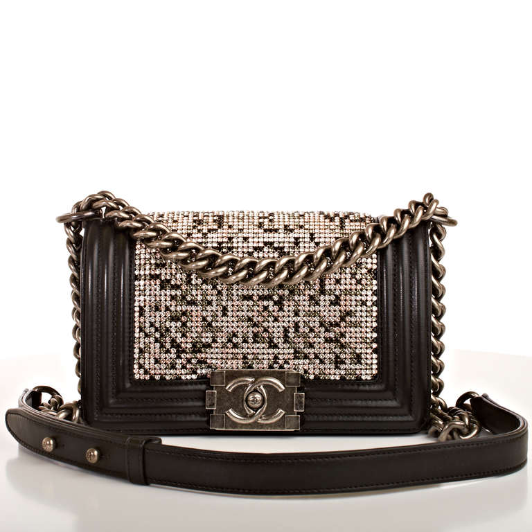 Chanel rare strass rhinestone (gold, silver and black colors) adorned Small Boy Flap Bag with ruthenium hardware, black lambskin trim detail, front flap with CC push lock closure and ruthenium chain link and black leather padded shoulder strap.