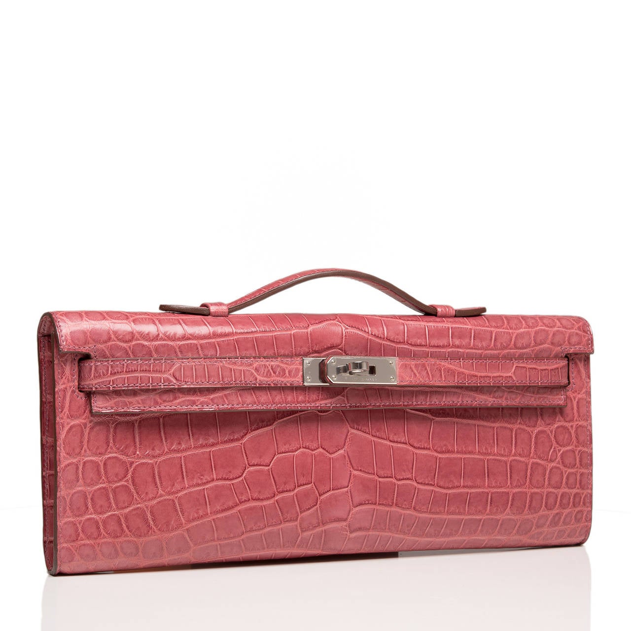 Hermes Bois de Rose matte niloticus crocodile Kelly Cut with palladium hardware.

This Kelly Cut in a gorgeous soft pink -- Bois de Rose -- is elegant with rare matte nilo crocodile skin and palladium hardware; the bag has tonal stitching, front