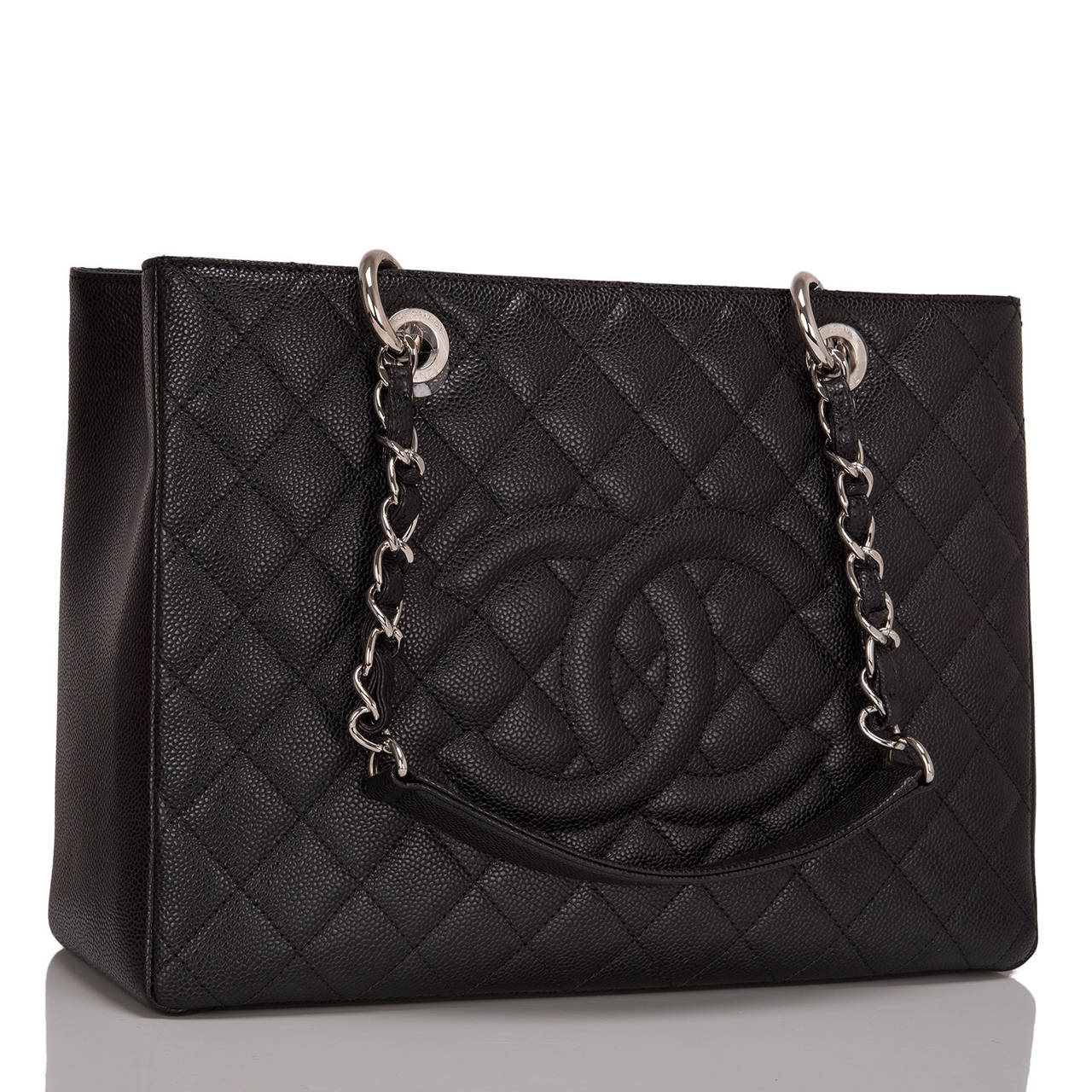 Chanel black quilted caviar leather Grand Shopper Tote (GST) bag with silver tone hardware.

This style features a front stitched CC logo, half moon back pocket and double interwoven silver tone chain link and leather padded straps.

The