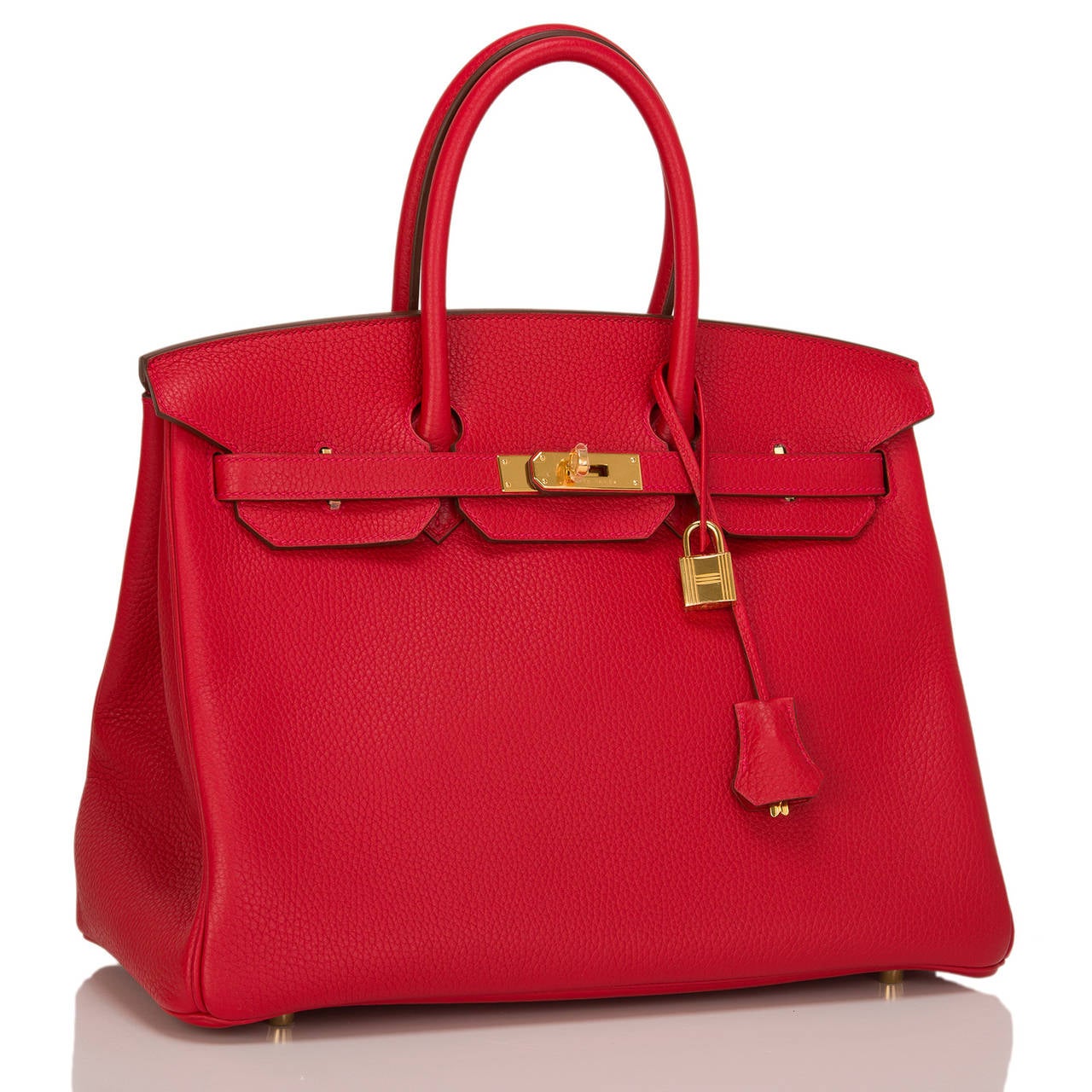 Hermes Rouge Casaque Birkin 35cm in clemence (baby bull) leather with gold hardware.

This Rouge Casaque Birkin features tonal stitching, front toggle closure, clochette with lock and two keys, and double rolled handles.

The interior is lined