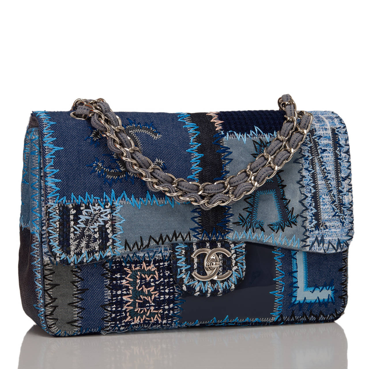 This Patchwork Jumbo Classic flap bag is unique in construction and design. An instant success, the funky and casual styling actual is a masterpiece of workmanship, incorporating numerous denim fabrics, boucle, and colors in a classic style with the