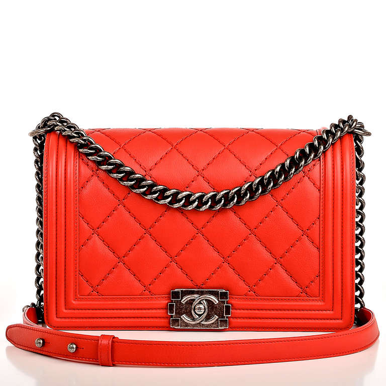 Chanel red quilted calfskin leather New Medium Boy Bag with all over double quilt pattern, ruthenium hardware, front flap with CC push lock closure and ruthenium chain link and red leather padded shoulder strap. Interior is lined in grey fabric with
