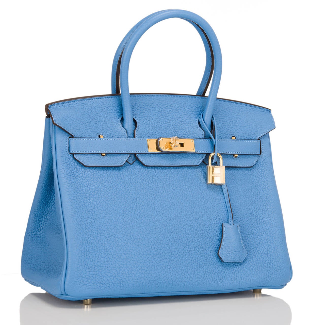 Hermes Blue Paradise Birkin 30cm in clemence leather with gold hardware.

The Hermes Birkin is the most coveted and the hardest to secure handbag in the world. Immediately recognizable by its shape, its thin straps with metal plates on the end of