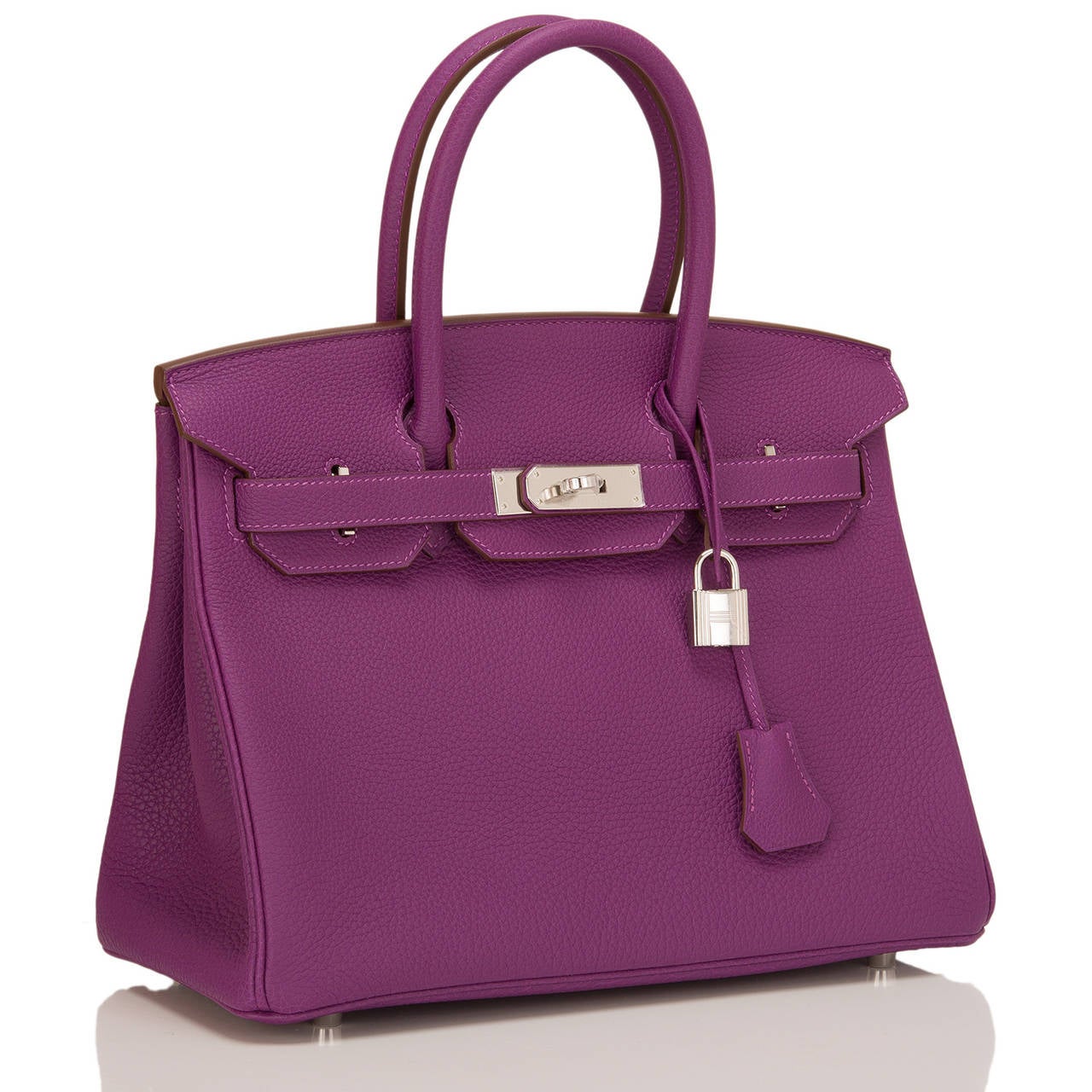 Hermes Anemone Birkin 30cm in togo (bull) leather with palladium hardware.

The Hermes Birkin is the most coveted and the hardest to acquire handbag in the world. Immediately recognizable by its shape, its thin straps with metal plates on the end