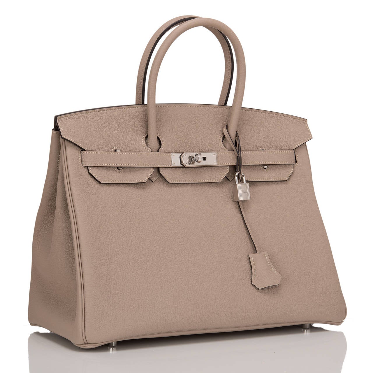Hermes Gris Tourterelle 35cm in togo (bull) leather with palladium hardware.

This Birkin features tonal stitching, front toggle closure, clochette with lock and two keys, and double rolled handles. The interior is lined in Gris T chevre with one