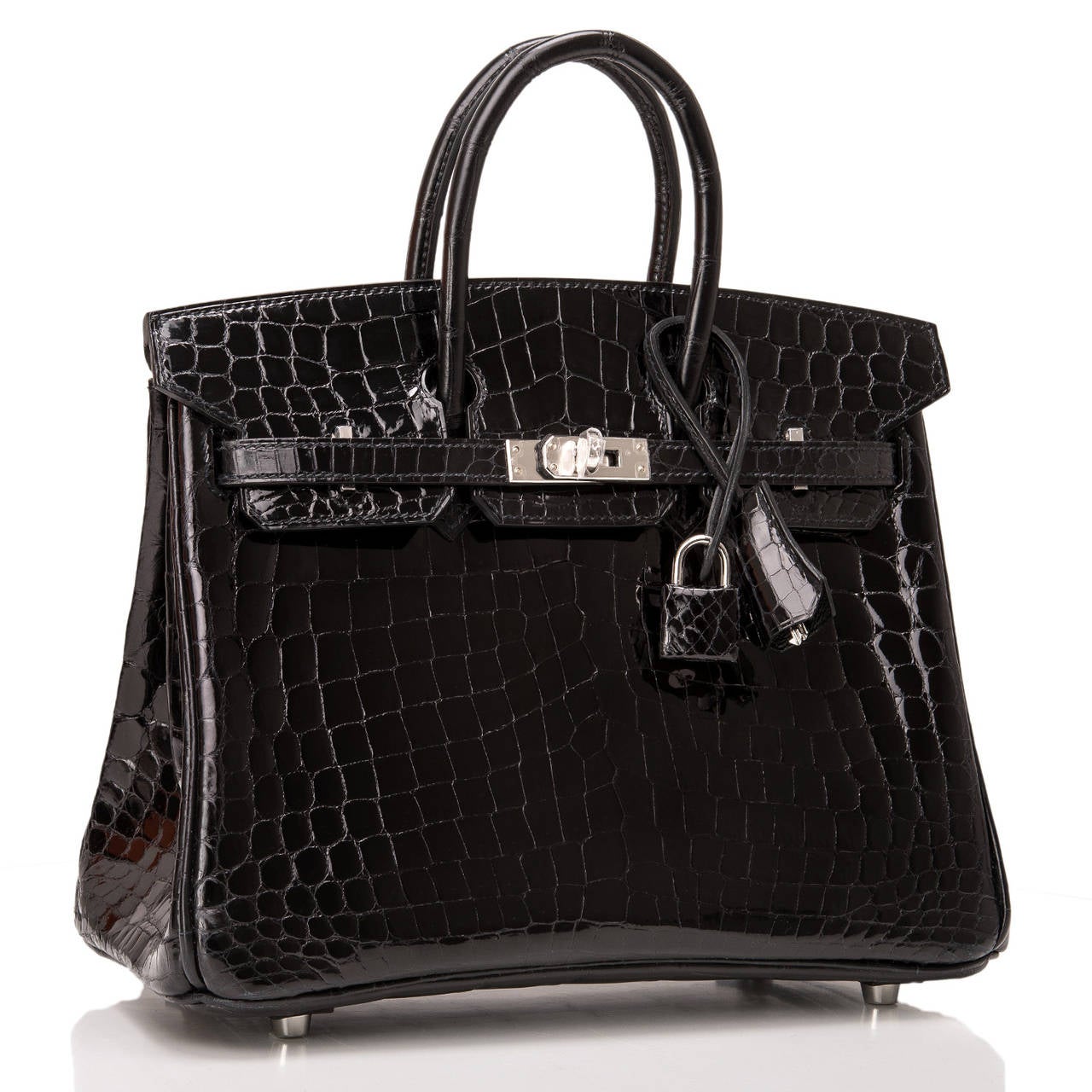 Hermes Black Birkin 25cm in niloticus crocodile with palladium hardware.

This style features tonal stitching, front toggle closure, clochette with lock and two keys, and double rolled handles.

The interior is lined in Black chevre with one zip