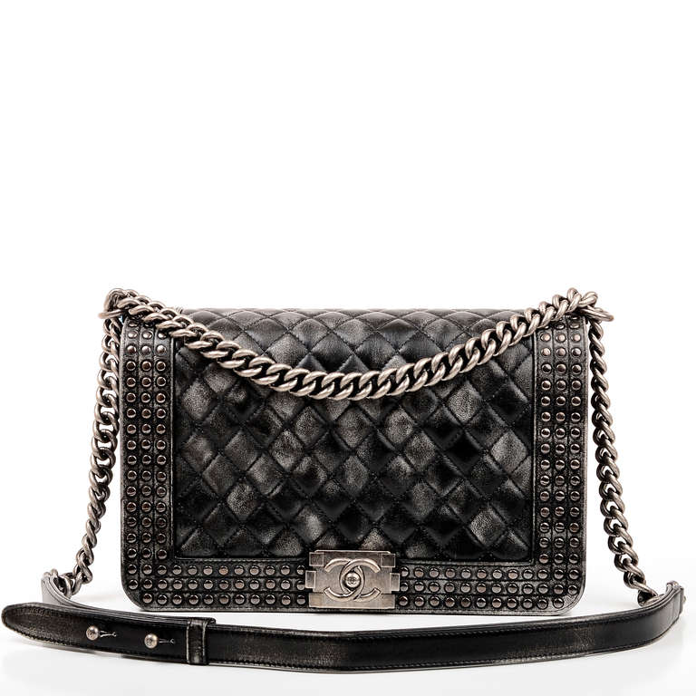 Chanel Faded Studded Medium Boy Bag of black and white faded calfksin leather quilted calfskin leather with ruthenium hardware, front flap with signature Boy CC push lock closure, ruthenium chain link and black leather padded shoulder strap and