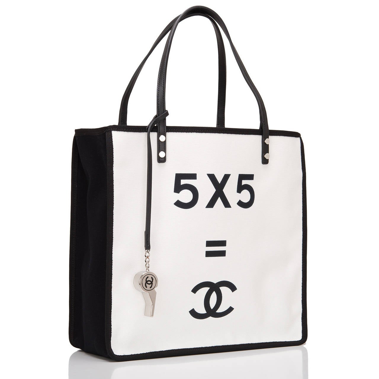 Chanel white canvas "5 x 5 = CC" white shopping tote with silver tone hardware.

This style features printed "5 x 5 = CC" demonstrate slogan at front, black canvas sides and double black leather straps.

The interior is lined