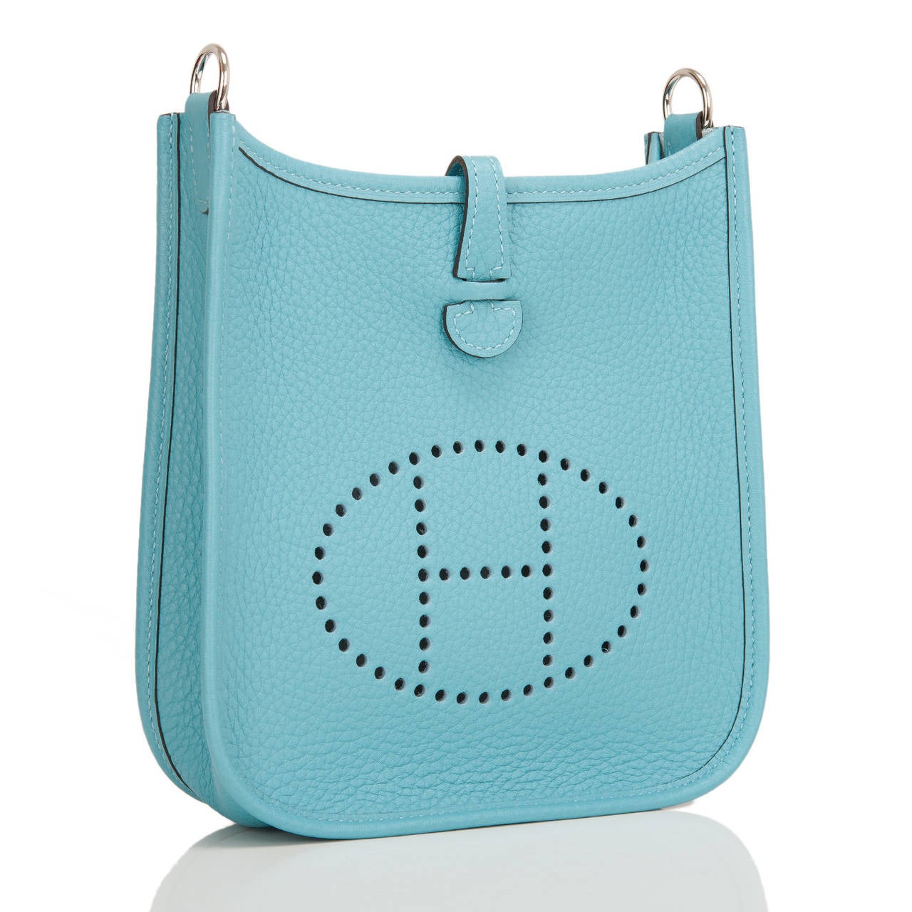 Hermes Blue Saint Cyr Evelyne TPM in clemence leather with palladium hardware.

This Evelyne III features Blue Saint Cyr clemence leather with palladium hardware, tonal stitching, large perforated H icon in circle at front, rear pocket, a pull tab