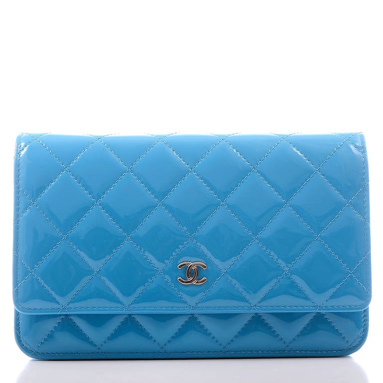 Chanel turquoise blue Classic Wallet On Chain (WOC) of quilted patent leather and silver tone hardware.

The Wallet On Chain (WOC) is one of the most desired Chanel accessories. Its great styling, versatility and attractive price point makes it a