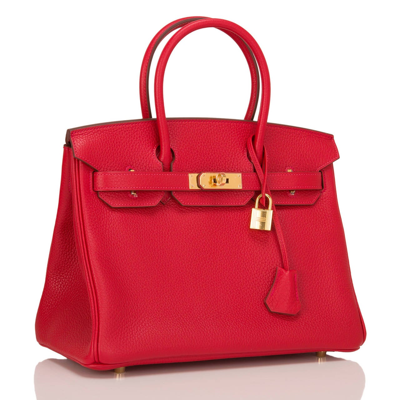 Hermes Rouge Casaque Birkin 30cm in clemence leather with gold hardware.

This Rouge Casaque Birkin features tonal stitching, front toggle closure, clochette with lock and two keys, and double rolled handles.

The interior is lined in Rouge