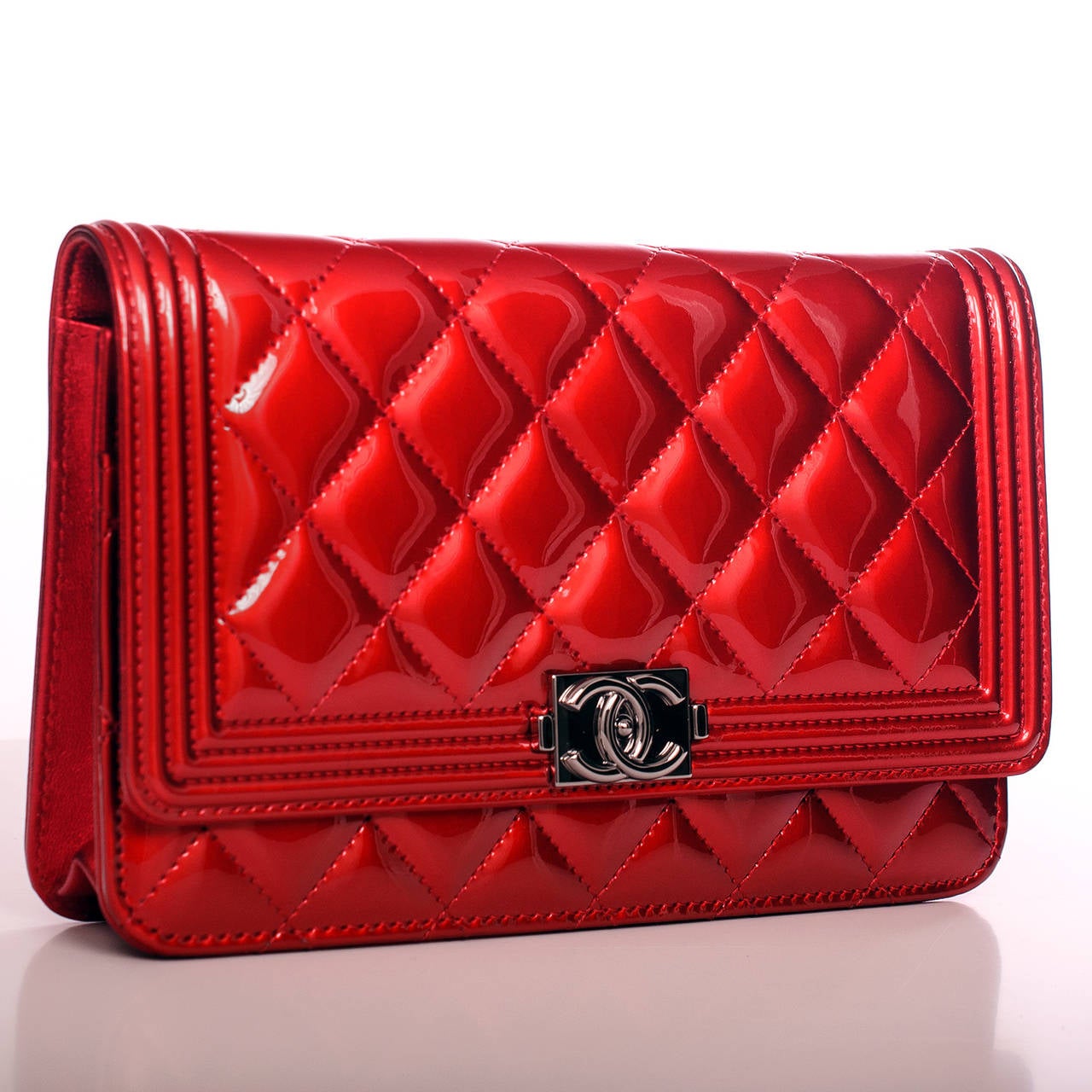 Chanel limited edition red Metallic Patent Boy Wallet On Chain (WOC) in quilted patent leather with ruthenium hardware.

The Wallet On Chain (WOC) is one of the most desired Chanel accessories. Its great styling, versatility and attractive price