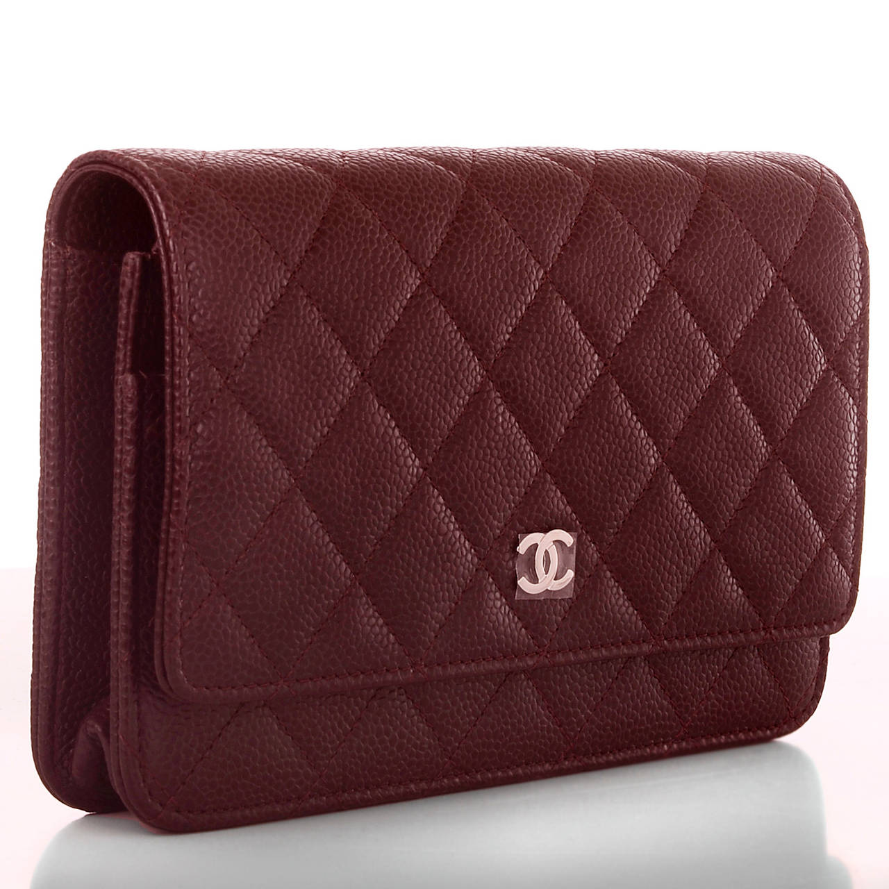 Chanel burgundy Classic Quilted Wallet On Chain (WOC) of quilted caviar leather with silver tone hardware.

The Wallet On Chain (WOC) is one of the most desired Chanel accessories. Its great styling, versatility and attractive price point makes it