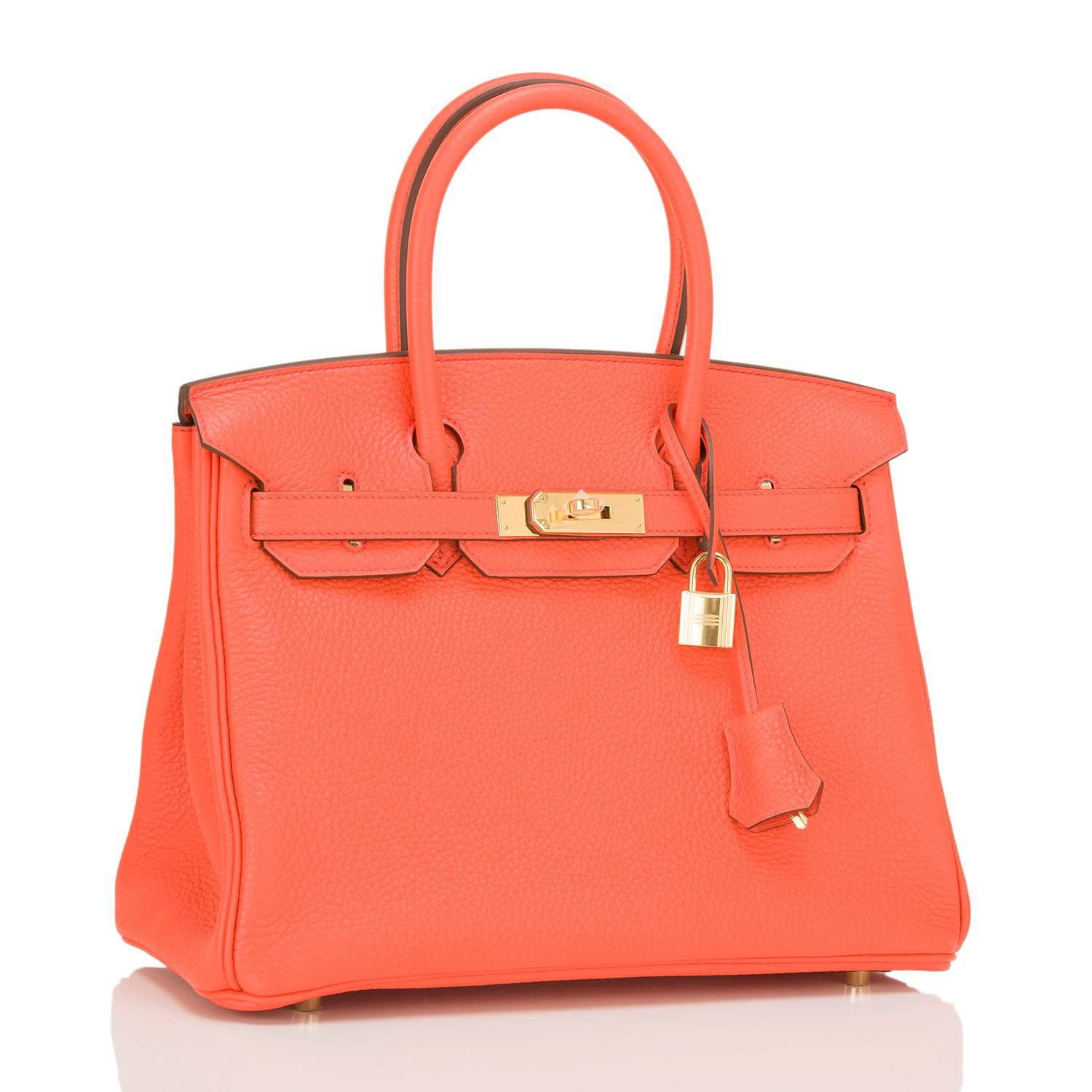 Hermes Orange Poppy 30cm in clemence leather with gold hardware.

This Birkin features tonal stitching, front toggle closure, clochette with lock and two keys, and double rolled handles. The interior is lined in Orange Poppy chevre with one zip