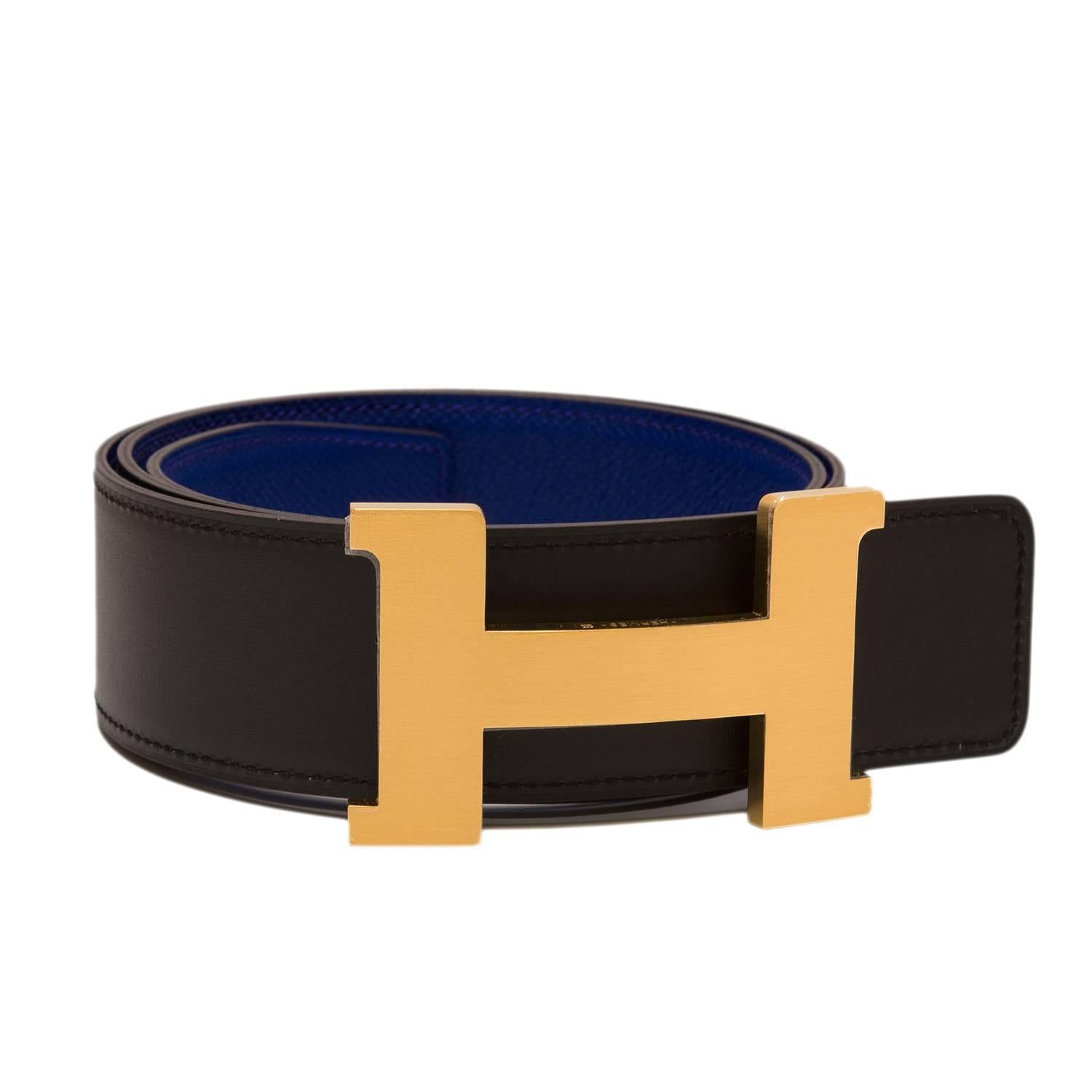 Hermes belt kit comprising an adjustable wide 42mm Constance H belt of blue electric epsom with tonal stitching reversing to black calfskin with tonal stitching accompanied by a removable brushed gold H buckle.

Origin: France

Condition: