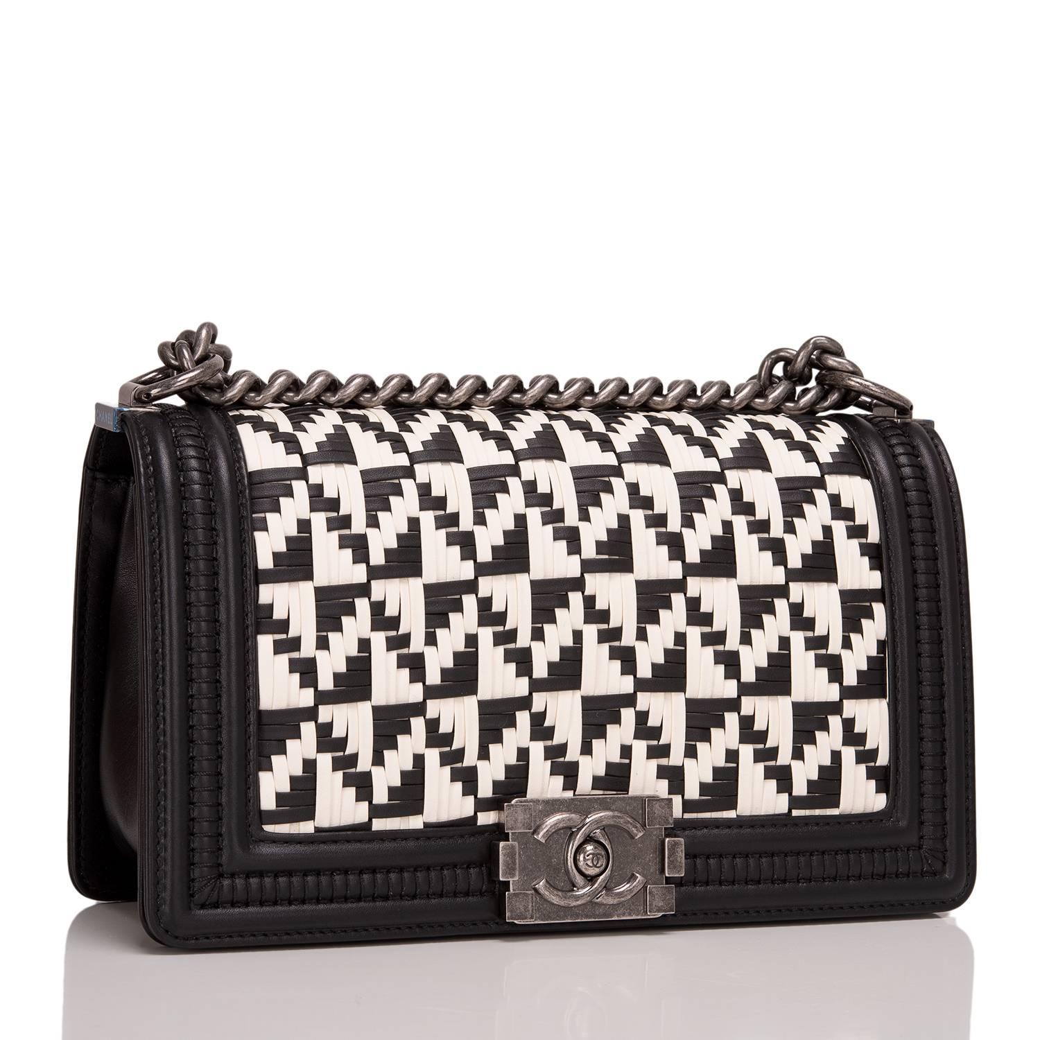 Chanel limited edition Medium Boy bag of calfskin leather accented with aged ruthenium hardware.

The bag features a black and white interwoven braided pattern (reminiscent of a French brasserie's floor), black leather trim, sides and bottom, full