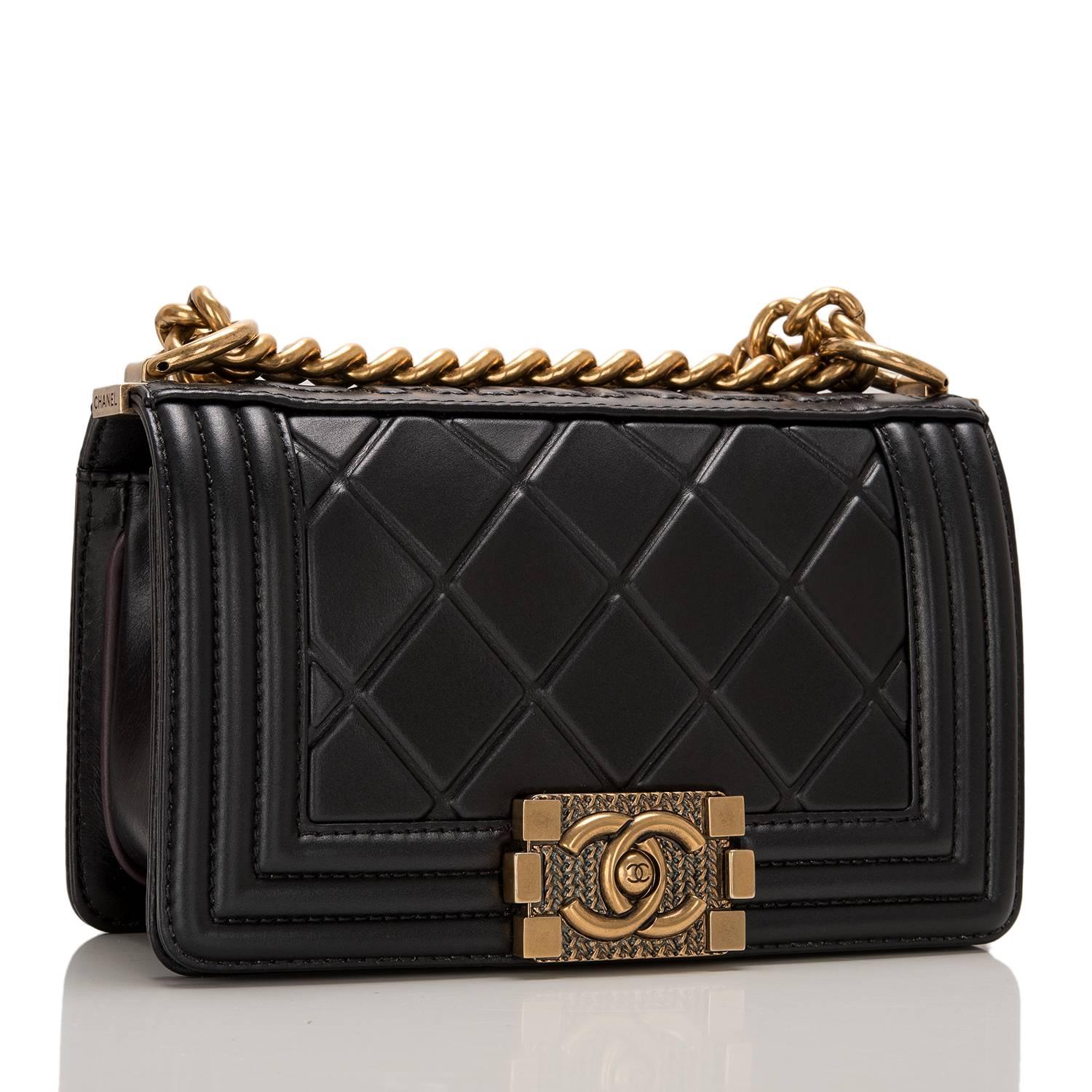Chanel limited edition Small Boy bag of black quilted calfskin leather accented by antique gold hardware.

The bag has C-H-A-N-E-L in raised letters across the top spine, full front flap with Le Boy CC push lock closure and antique gold tone chain