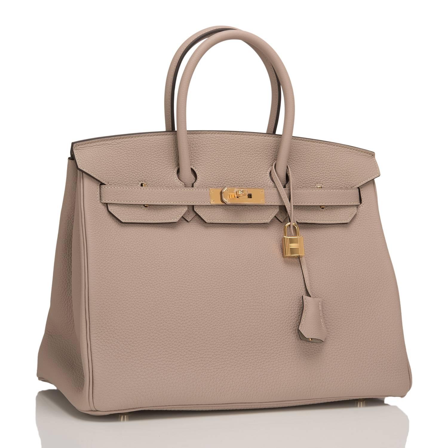  	
This Hermes Gris Tourterelle Birkin 35cm in togo leather with gold hardware.

This Birkin features tonal stitching, front toggle closure, clochette with lock and two keys, and double rolled handles.

The interior is lined in Gris Tourterelle