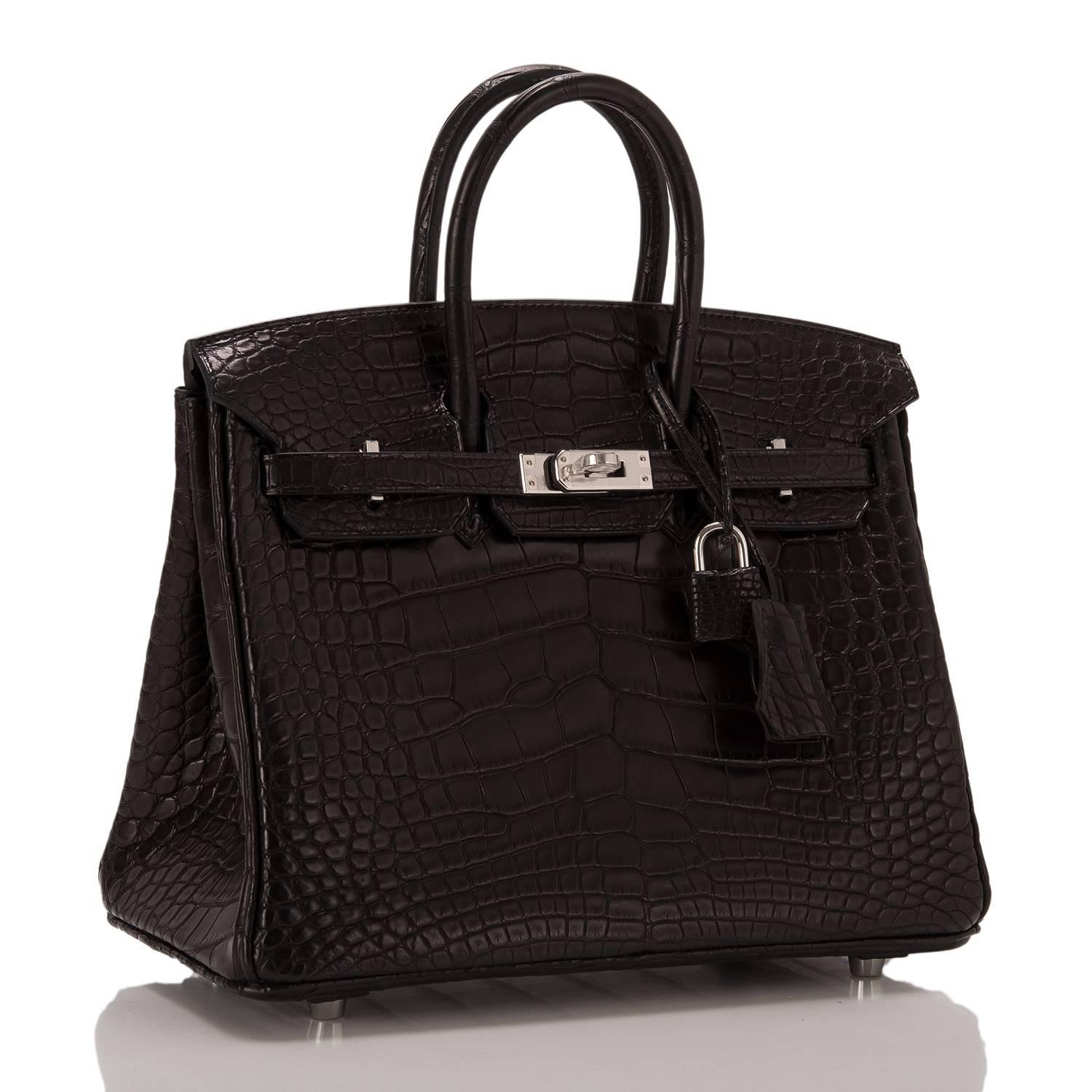 Hermes Black Birkin 25cm in matte alligator with palladium hardware.

This style features tonal stitching, front toggle closure, clochette with lock and two keys, and double rolled handles.

The interior is lined in Black chevre with one zip