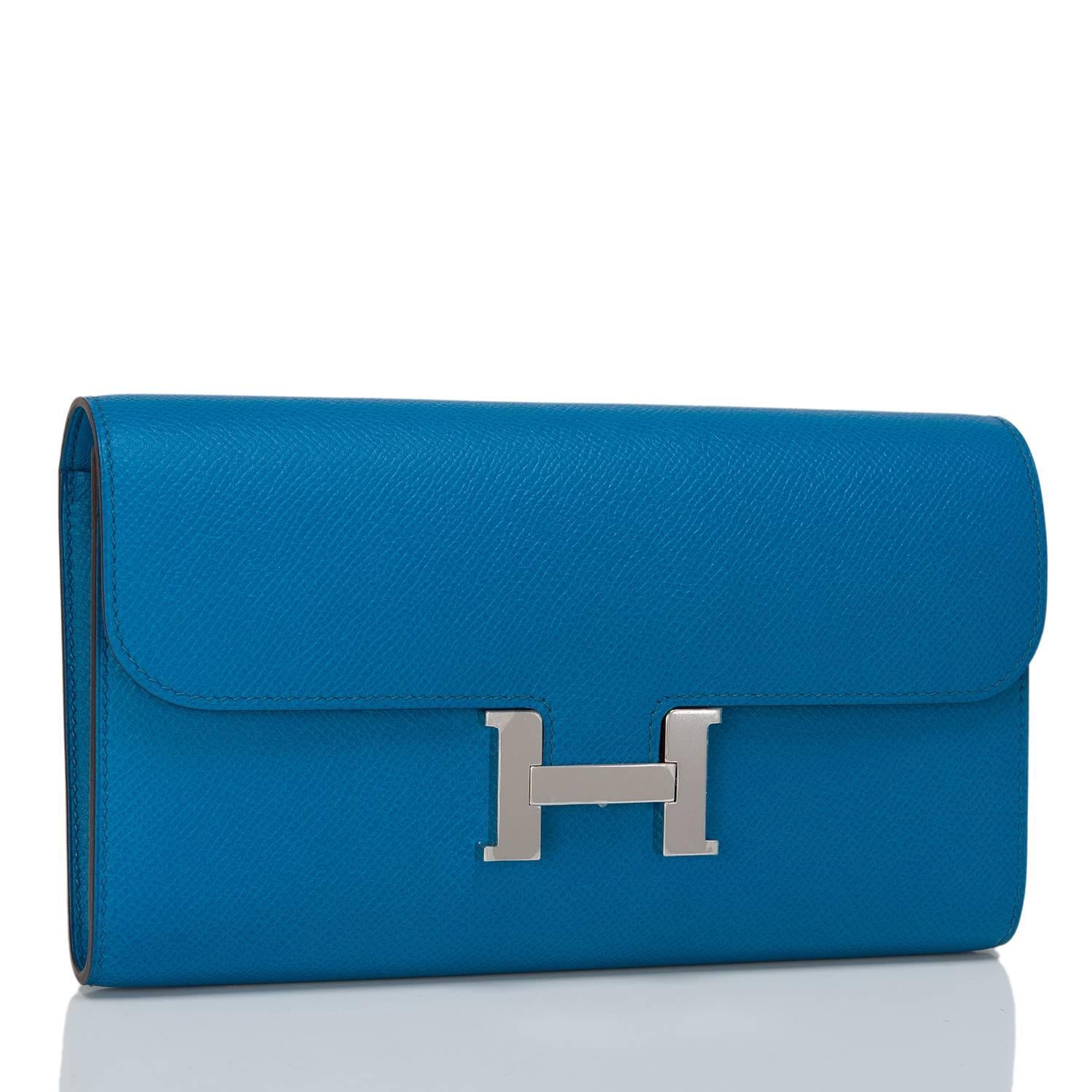 This classic Hermes Constance Long Wallet in Blue Izmir epsom leather with palladium hardware features tonal stitching, metal 