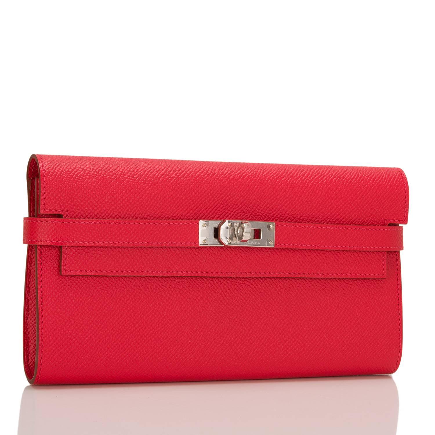 Hermes Rouge Pivoine Epsom leather Kelly Longue (Long) Wallet with palladium hardware.

This style features tonal stitching, palladium hardware, front toggle closure and gusseted sides.

The interior is lined in Rouge Pivoine chevre leather and