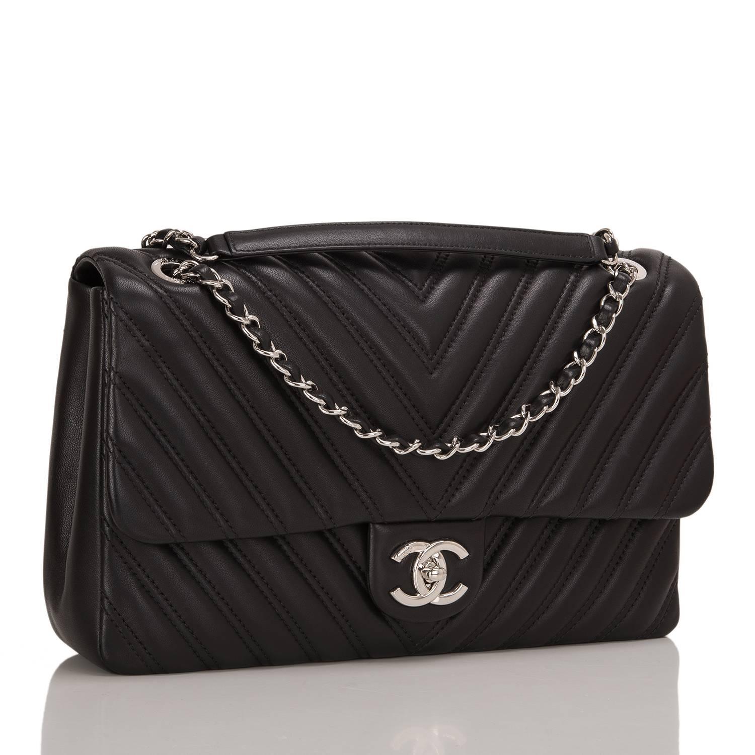 Chanel black Chevron Jumbo Flap bag of lambskin leather with silver tone hardware.

The bag features a front flap with signature CC turnlock closure, double stitched Chevron quilting, and an adjustable interwoven silver tone chain link and black