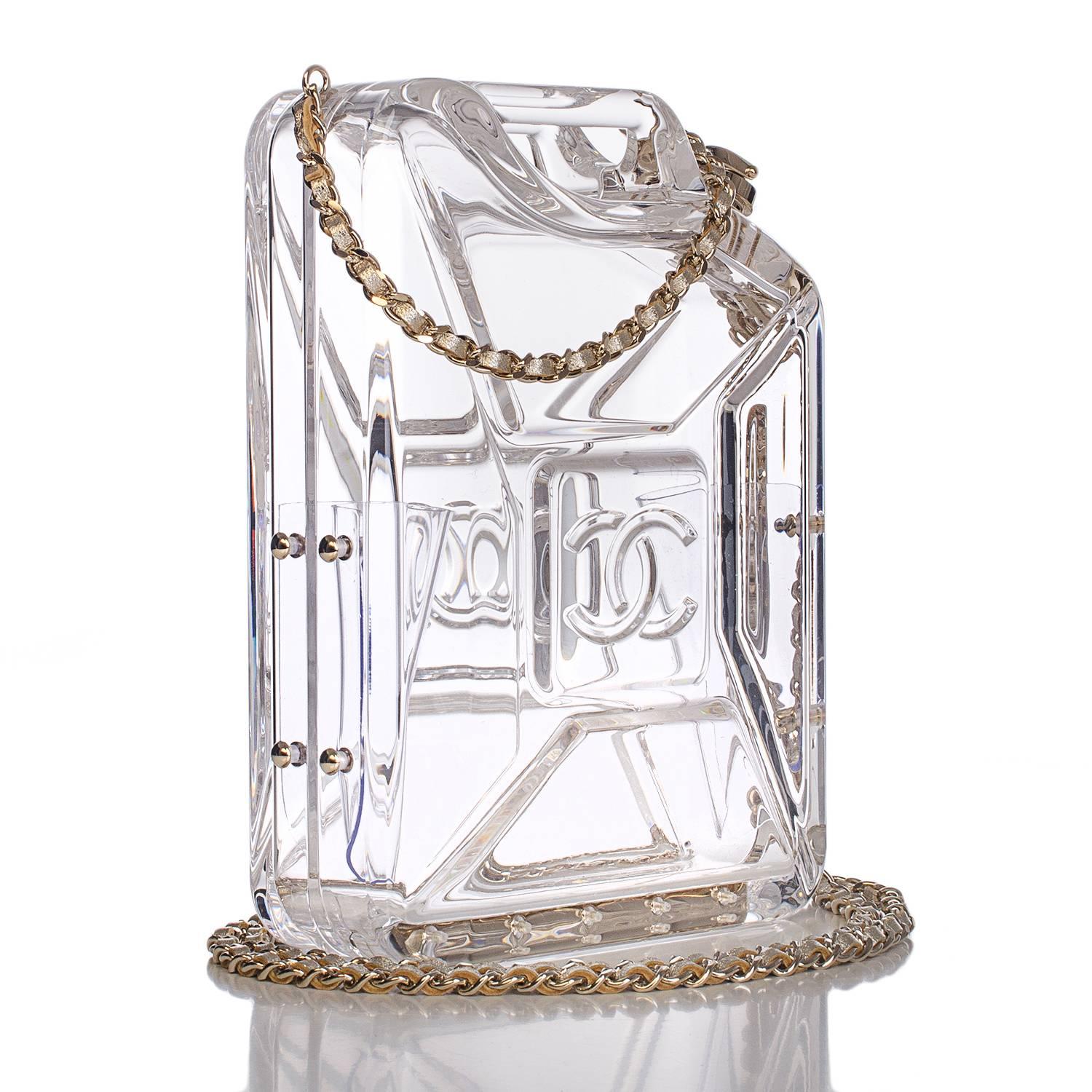 Chanel limited edition Dubai By Night Gas Tank minaudière bag of clear plexiglass with light gold tone metal hardware.

This runway bag is made of clear plexiglass in the style of a 