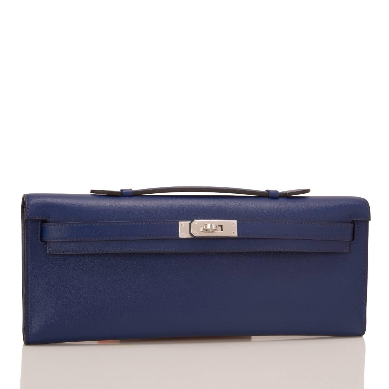 Hermes Blue Sapphire (Bleu Saphir) Kelly Cut clutch in swift leather with palladium hardware.
This bag has tonal stitching, palladium hardware, front straps with toggle closure and a flat handle.

The interior is lined in Blue Sapphire chevre and
