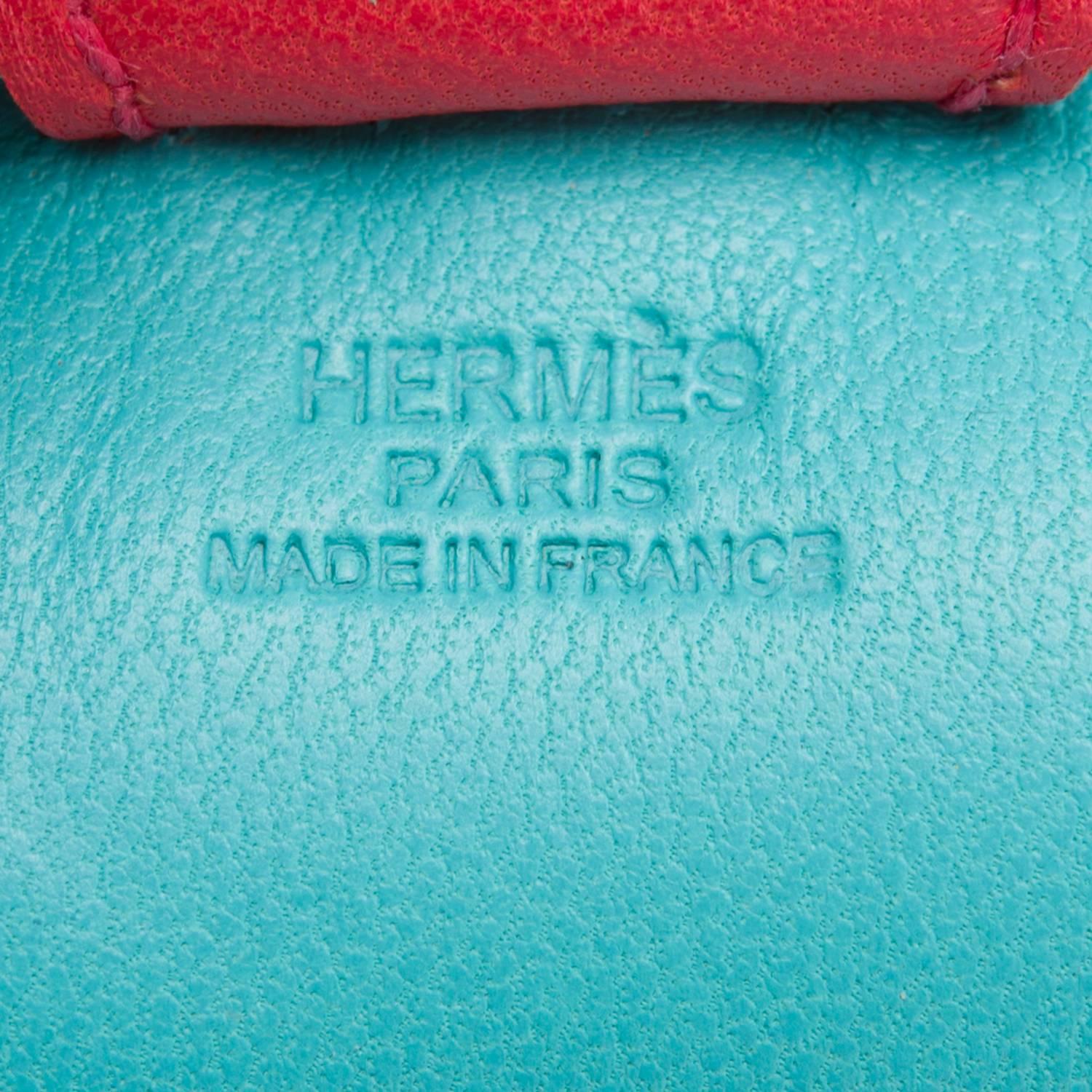 Hermes Grigri Rodeo bag charm in size PM
This charm is made of Blue Lagoon (Lagon) Milo lambskin leather and accented with a Blue Izmir mane and tail and a Bougainvillea saddle and holder.

Origin: France

Condition: Never