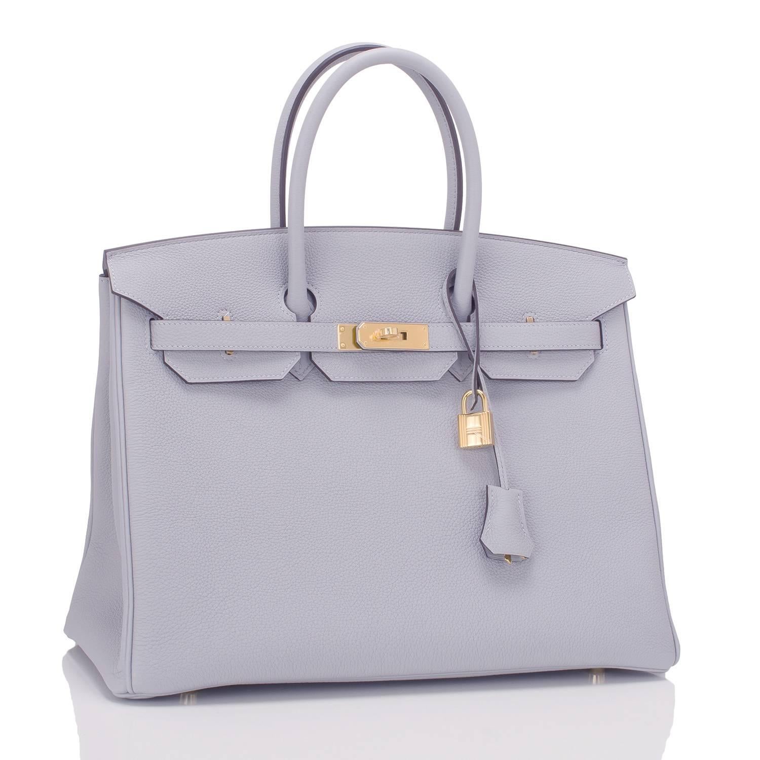 Hermes Blue Glacier Birkin 35cm in togo (bull) leather with gold hardware.

This Birkin features tonal stitching, front toggle closure, clochette with lock and two keys, and double rolled handles.

The interior is lined in Blue Glacier chevre