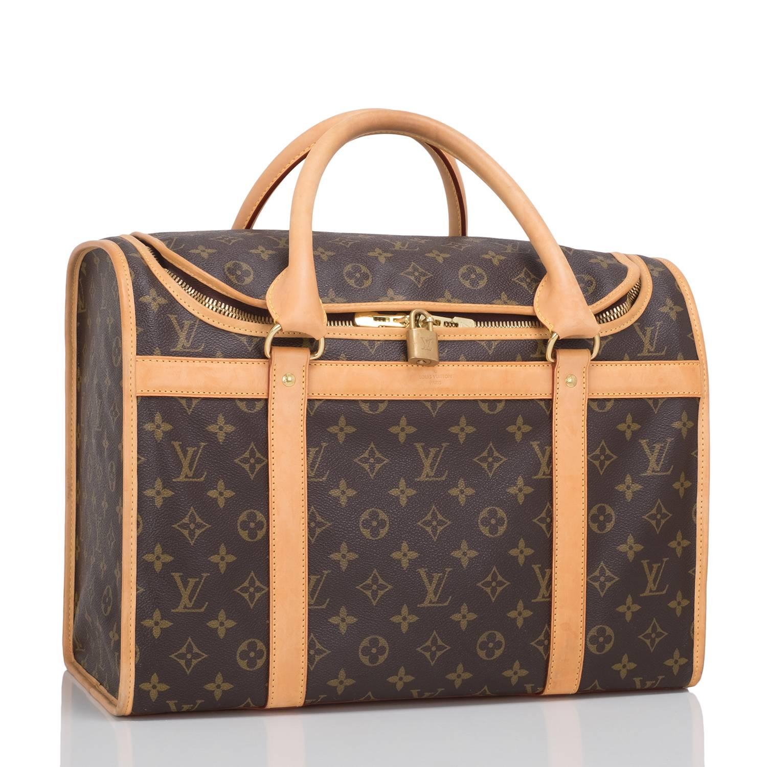 Louis Vuitton Monogram Canvas Dog Carrier 40 of Monogram coated canvas, natural cowhide (vachetta) and golden brass hardware.

This carrier has golden brass Louis Vuitton stamped hardware, natural cowhide (vachetta) trim, breathable side mesh with