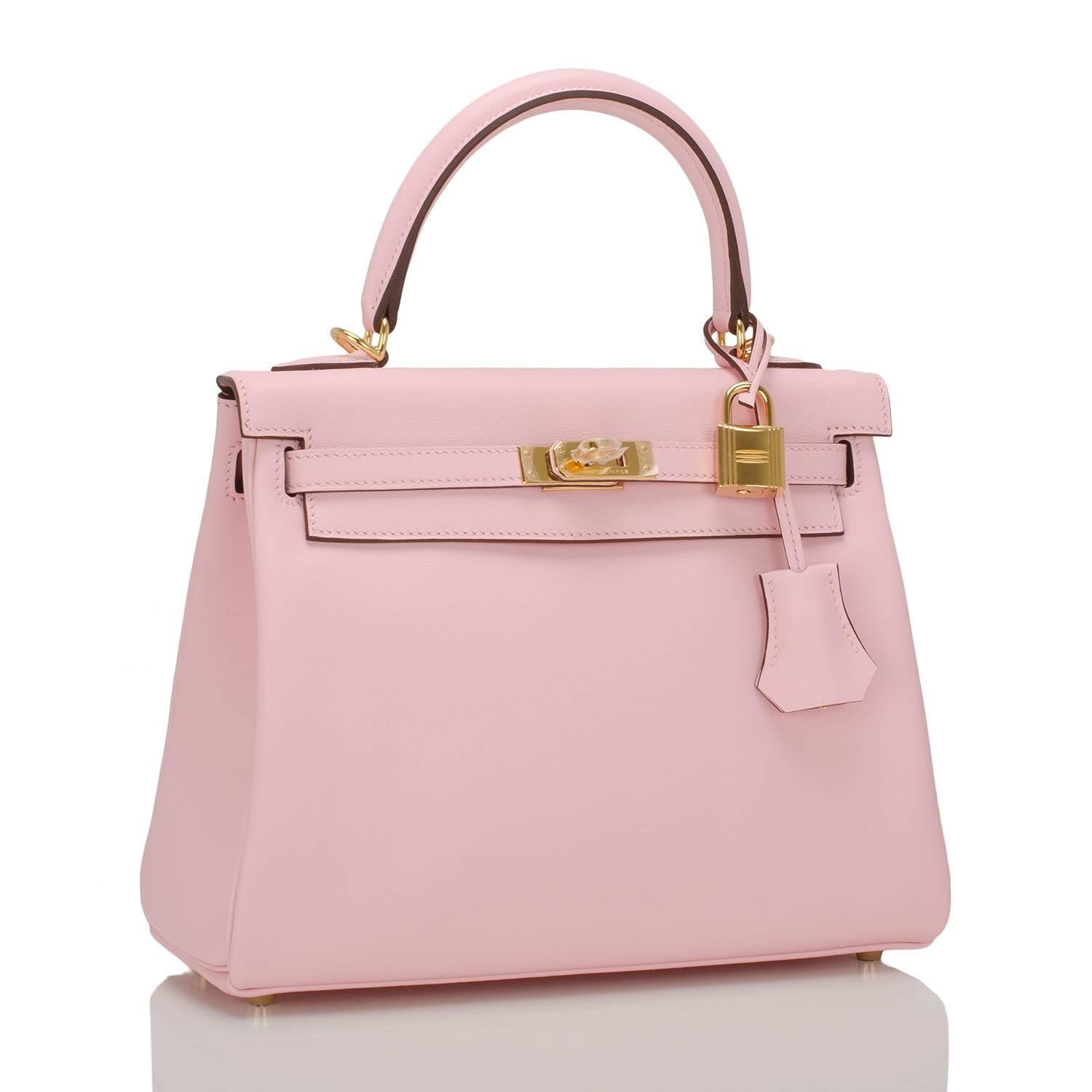 Hermes Rose Sakura Retourne Kelly 25cm in swift leather with gold hardware.

This Kelly in the relaxed Retourne style features tonal stitching, front toggle closure, clochette with lock and two keys, single rolled handle and optional shoulder