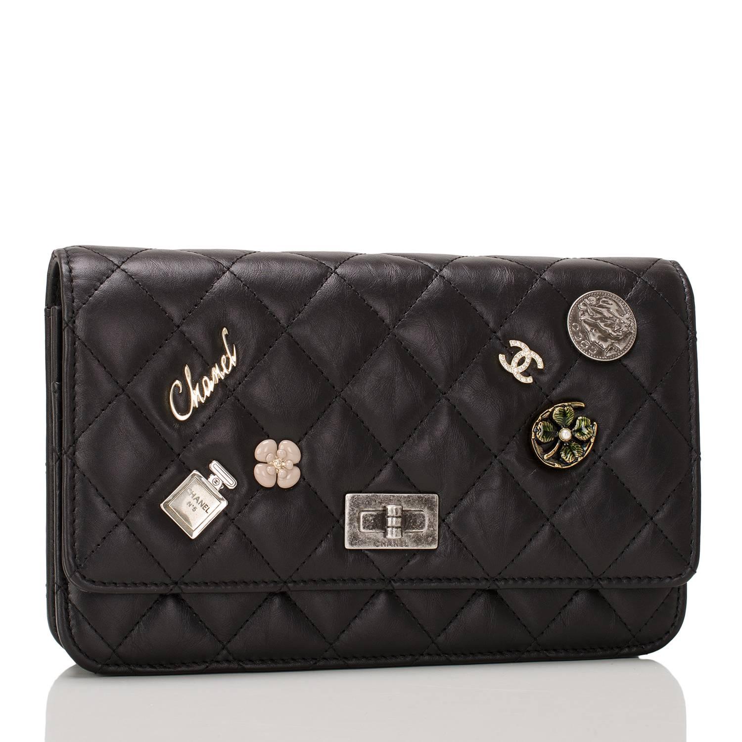  	
Chanel limited edition Lucky Charms Wallet On Chain in quilted black aged calfskin with aged ruthenium hardware.

The bag features six iconic Chanel charms on front flap: No. 5 Perfum, Coco medallion, four leaf clover, enamel camellia,