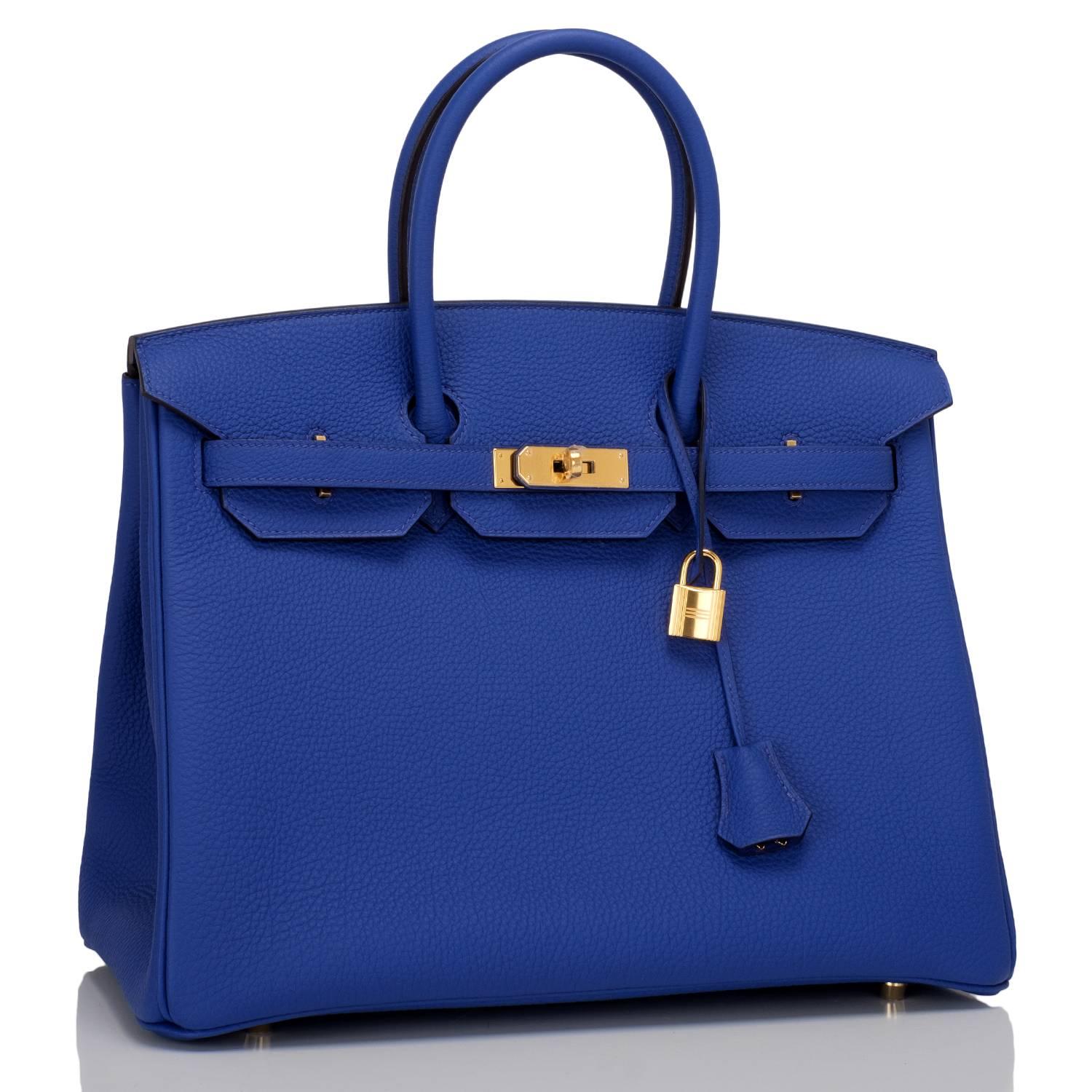 Hermes Blue Electric Birkin 35cm in togo leather with gold hardware.

This Birkin features tonal stitching, front toggle closure, clochette with lock and two keys, and double rolled handles. Interior is lined in Blue Electric chevre with one zip