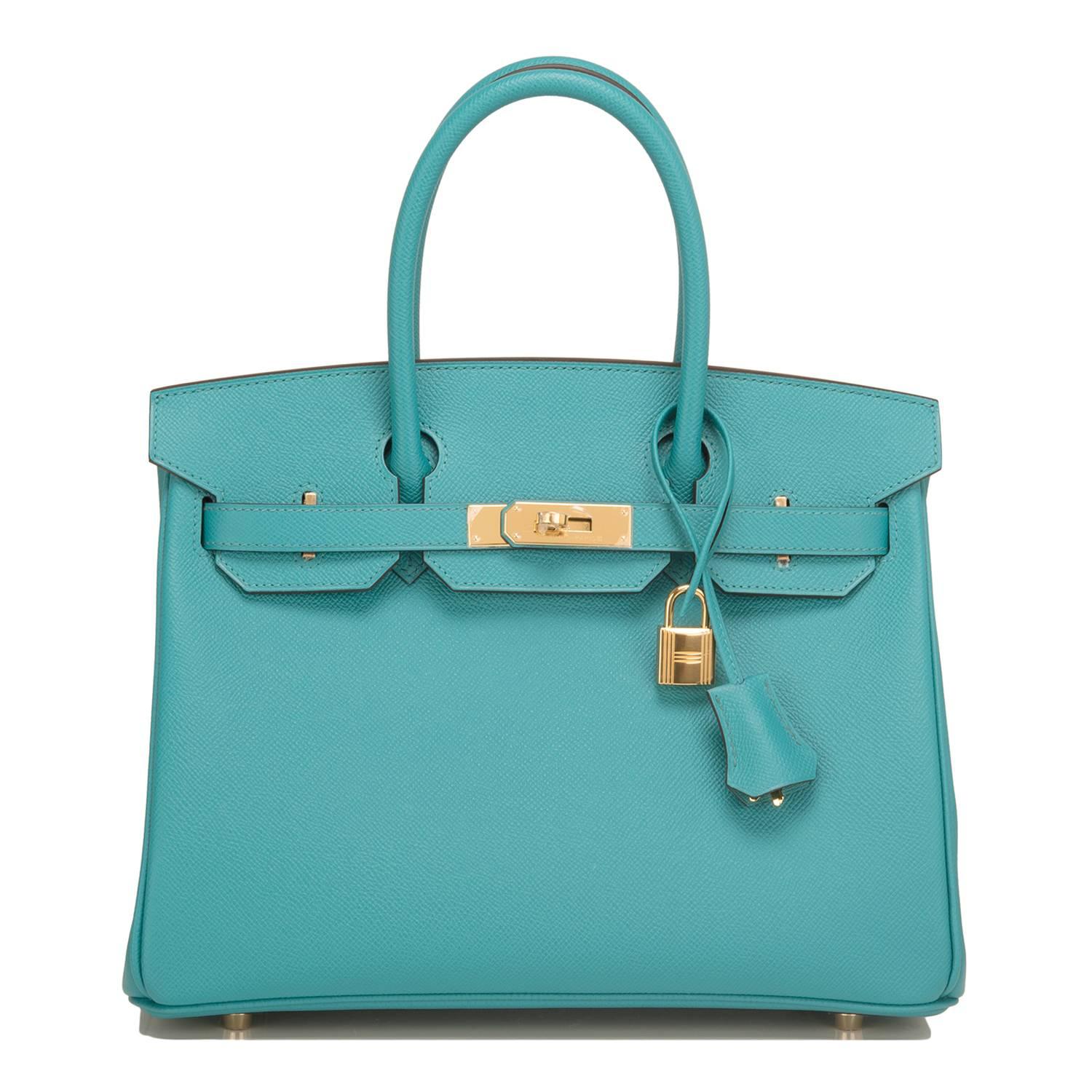 Hermes Blue Paon Birkin 30cm of epsom leather with gold hardware.

This Birkin has tonal stitching, a front toggle closure, a clochette with lock and two keys, and double rolled handles.

The interior is lined with Blue Paon chevre and has one