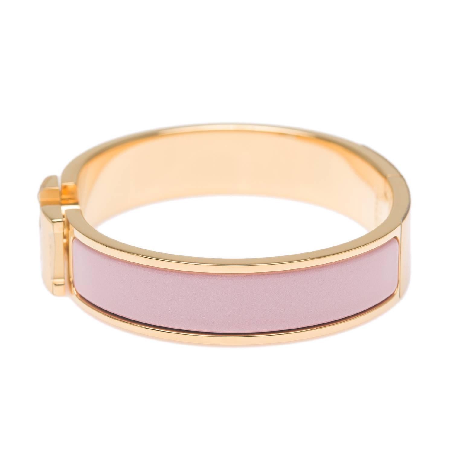 Hermes narrow Clic Clac H bracelet in Rose Nacarat enamel closure with gold plated hardware in size PM.

Origin: France

Condition: Pristine; never worn

Accompanied by: Hermes box, Hermes dustbag, carebook

Measurements: Diameter: 2.25";