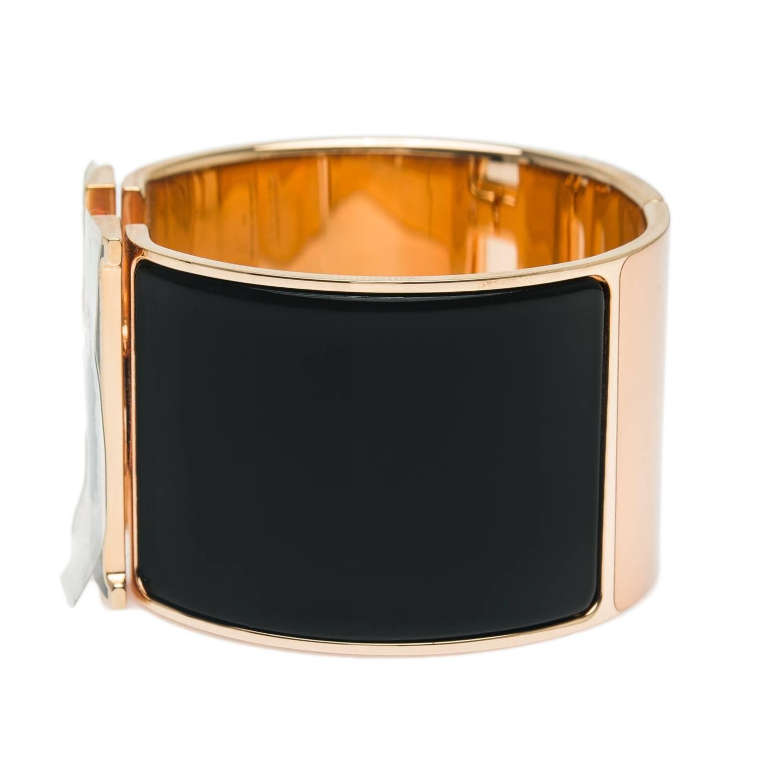 Hermes extra wide black enamel Clic Clac H bracelet with black lacquer H and rose gold plated hardware in size PM.

Origin: France

Condition: Never worn

Accompanied by: Hermes box, Hermes dustbag

Measurements: Diameter: 2.25