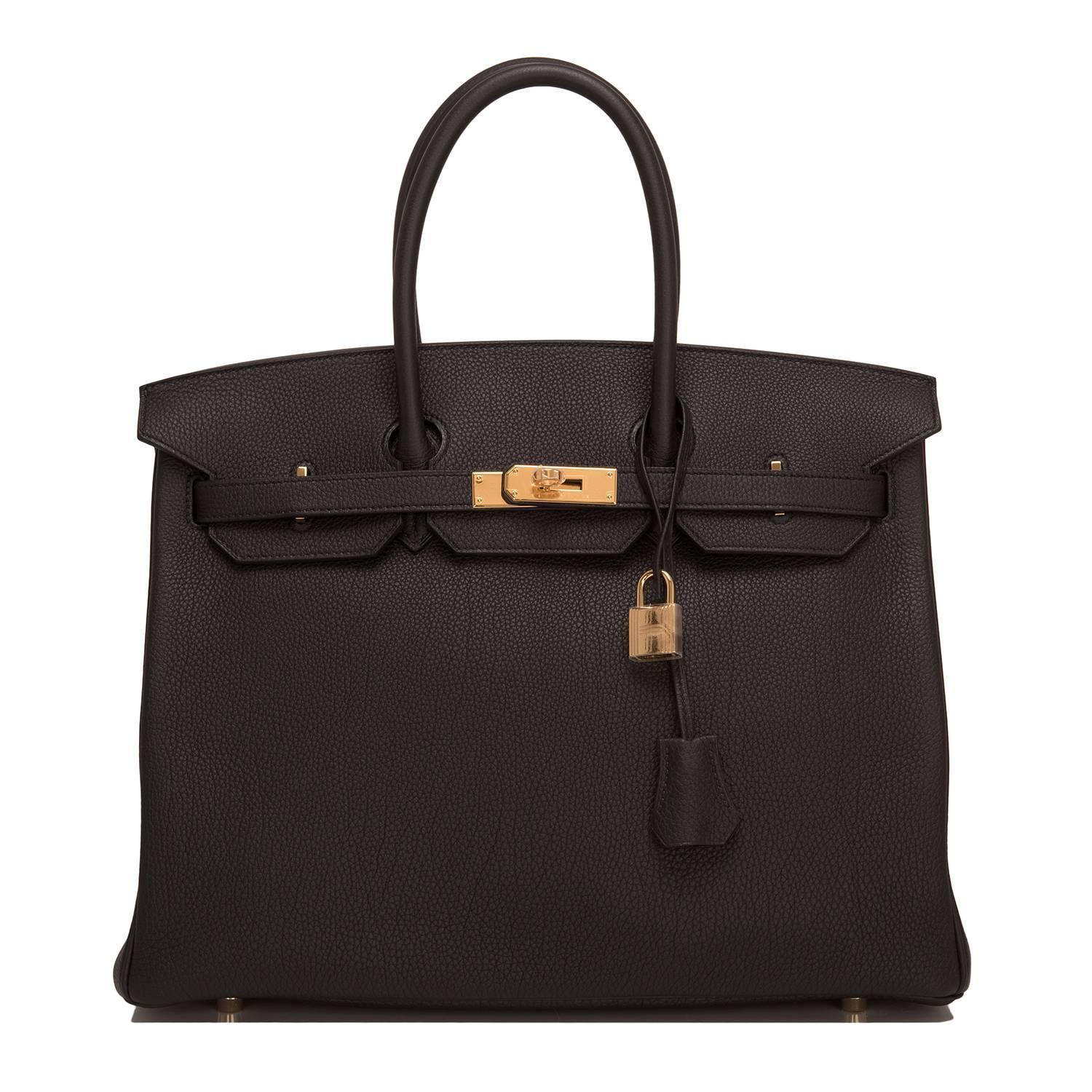 Hermes black Birkin 35cm in togo leather with gold hardware.

This Birkin features tonal stitching, front toggle closure, clochette with lock and two keys, and double rolled handles.

The Interior is lined in Black chevre with one zip pocket