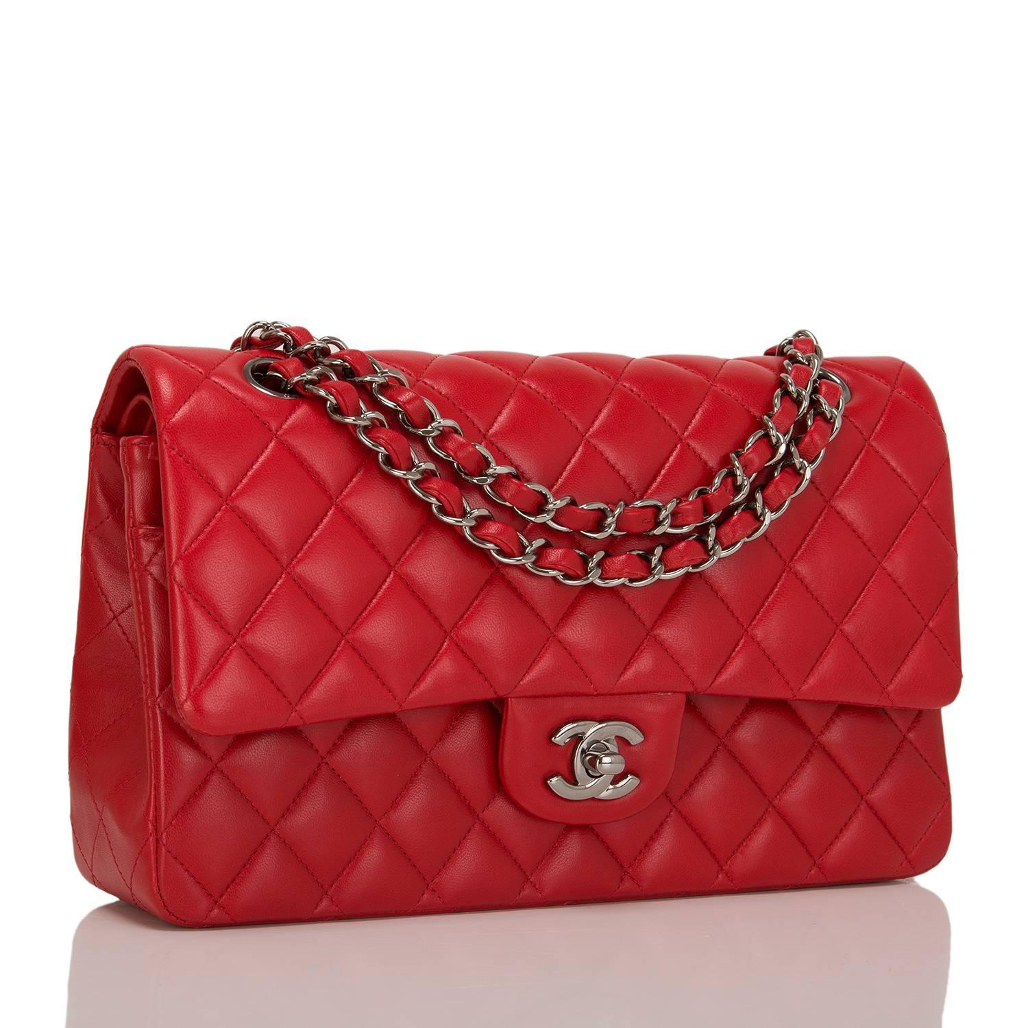 Chanel Medium Classic double flap bag of red quilted lambskin and ruthenium hardware features front flap with signature CC turnlock closure, half moon back pocket and adjustable interwoven aged ruthenium chain link and red leather shoulder