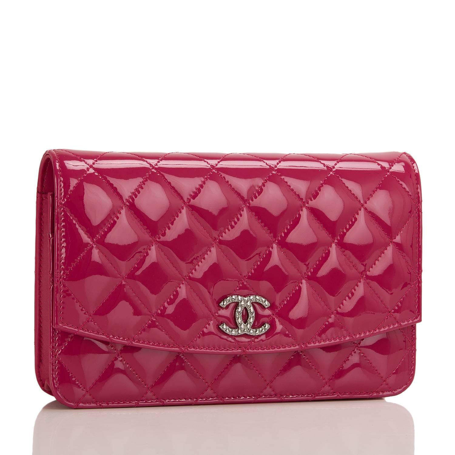 This dark red quilted patent timeless WOC with ruthenium hardware features signature Chanel quilting, front flap with CC charm and hidden snap closure, expandable sides and bottom, half moon rear pocket and interwoven ruthenium chain and leather