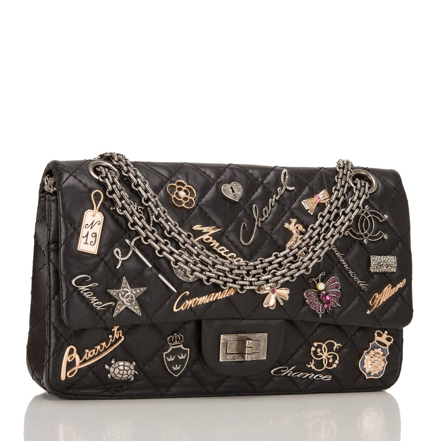  	
This limited edition Chanel Reissue 2.55 Lucky Charms flap bag in size 225 is made of black aged calfskin leather and accented with aged ruthenium hardware.

The bag features 21 iconic Chanel charms including Coco, Star, Camellia, Turtle and