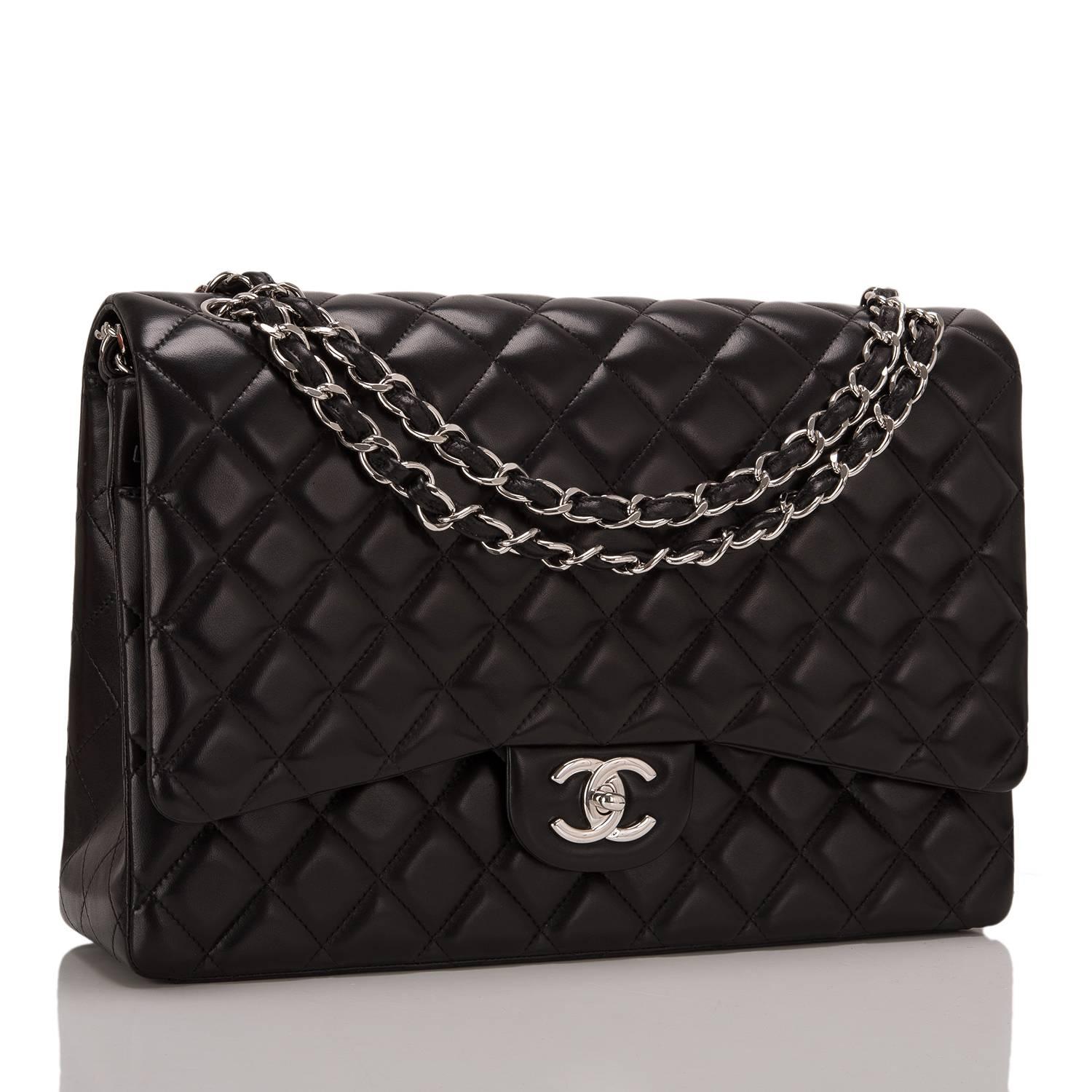 This Chanel Maxi Classic double flap bag is made of black lambskin leather and accented with silver tone hardware. The bag features a front flap with signature CC turnlock closure, a half moon back pocket, and an adjustable interwoven silver tone