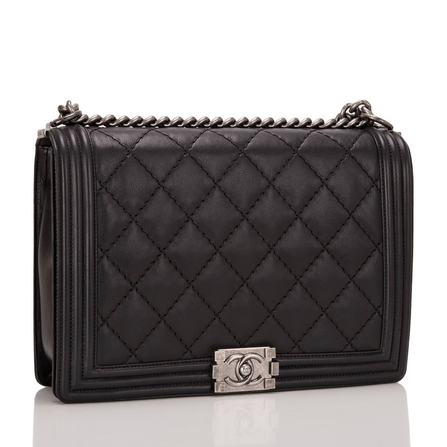 This Large Boy bag is made of pearlized black calfskin leather and accented with aged ruthenium hardware.

The bag features double quilted leather trims in smooth calfskin, a full front flap with the Boy signature CC push lock closure, and a