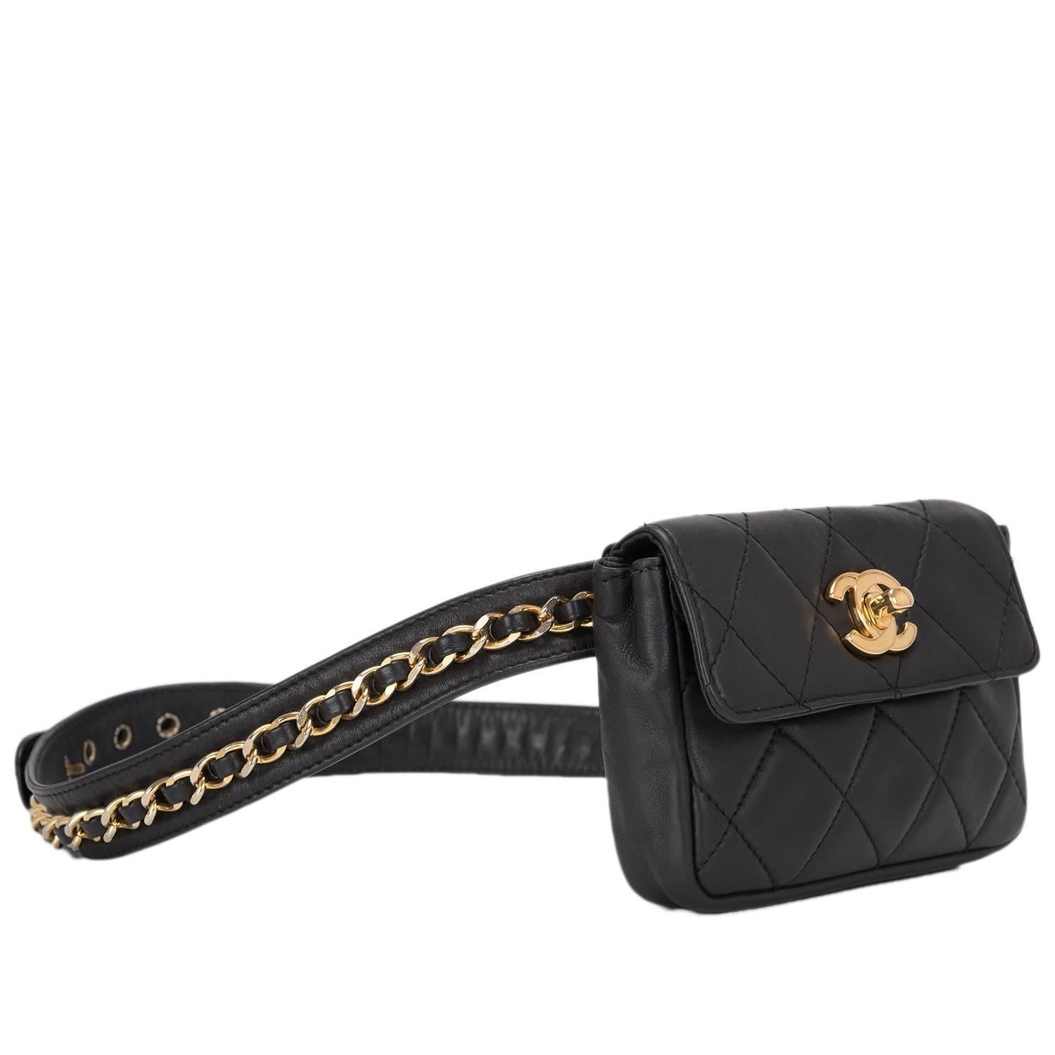 This Chanel vintage black quilted Iconic Chained Fanny Pack belt bag is made of lambskin and accented with gold tone hardware.

The bag feature a signature CC hardware closure and adjustable iconic chained leather belt.

The Interior is lined in