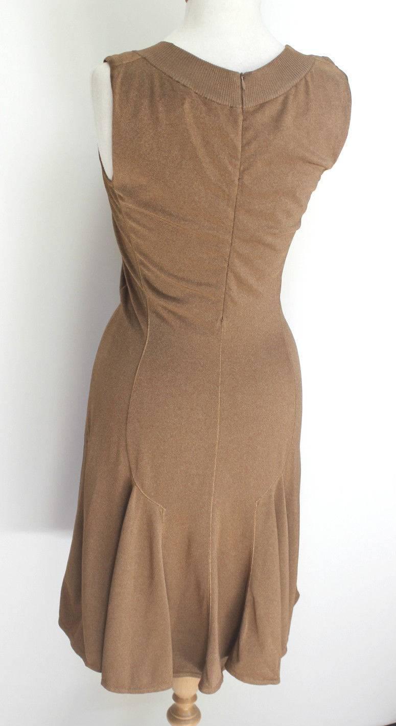 Alaia knit dress made from his signature stretch knit 
This gorgeous dress features a boat neckline, can be worn on or off the shoulder 
Length 38 inches, waist 13 inches, chest 17 inches across laid flat, not stretched 
Viscose %60 %36 Nylon %4